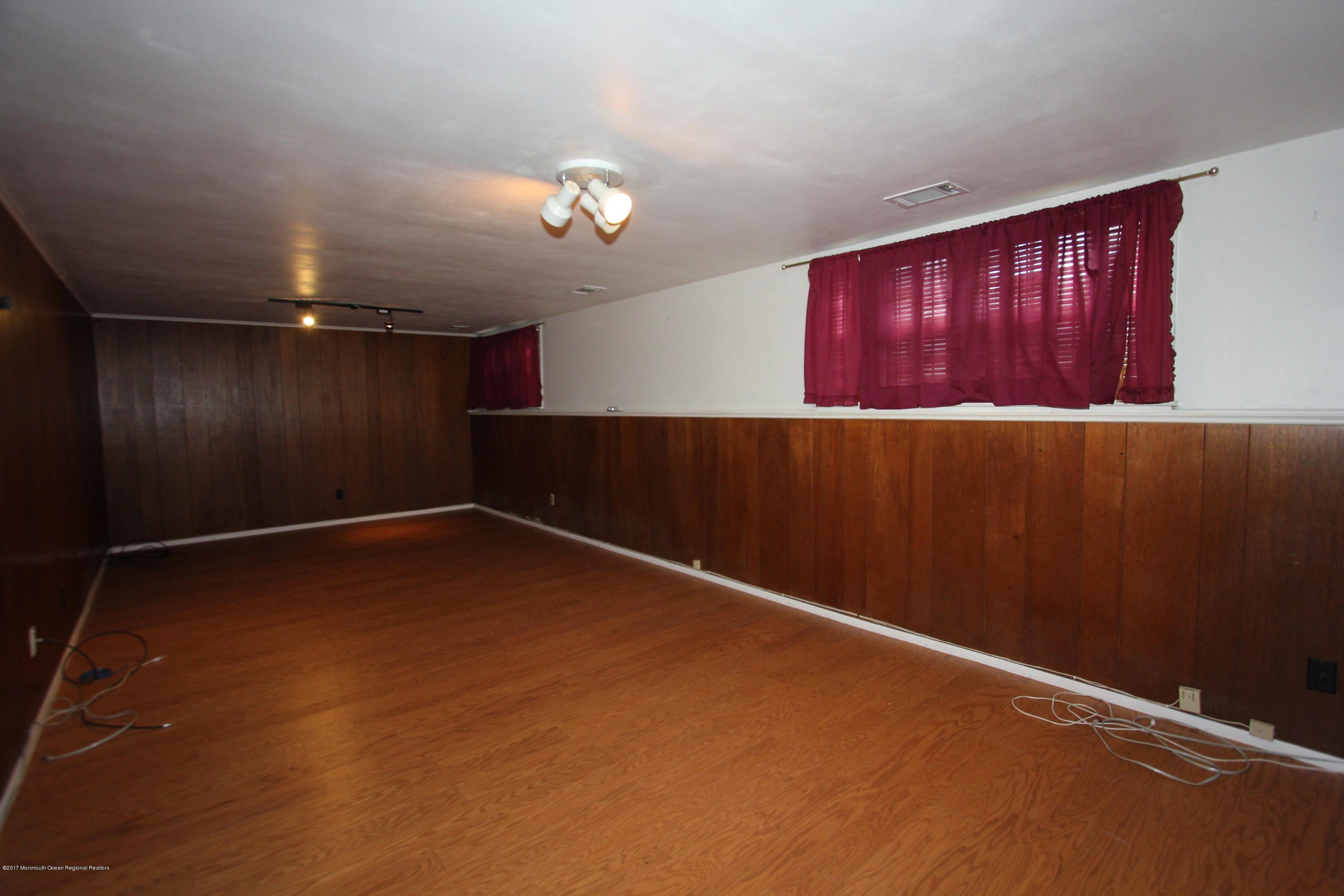 904 Fordham Road Neptune Township, NJ 07753 - Photo 22 of 24 en empty room with windows