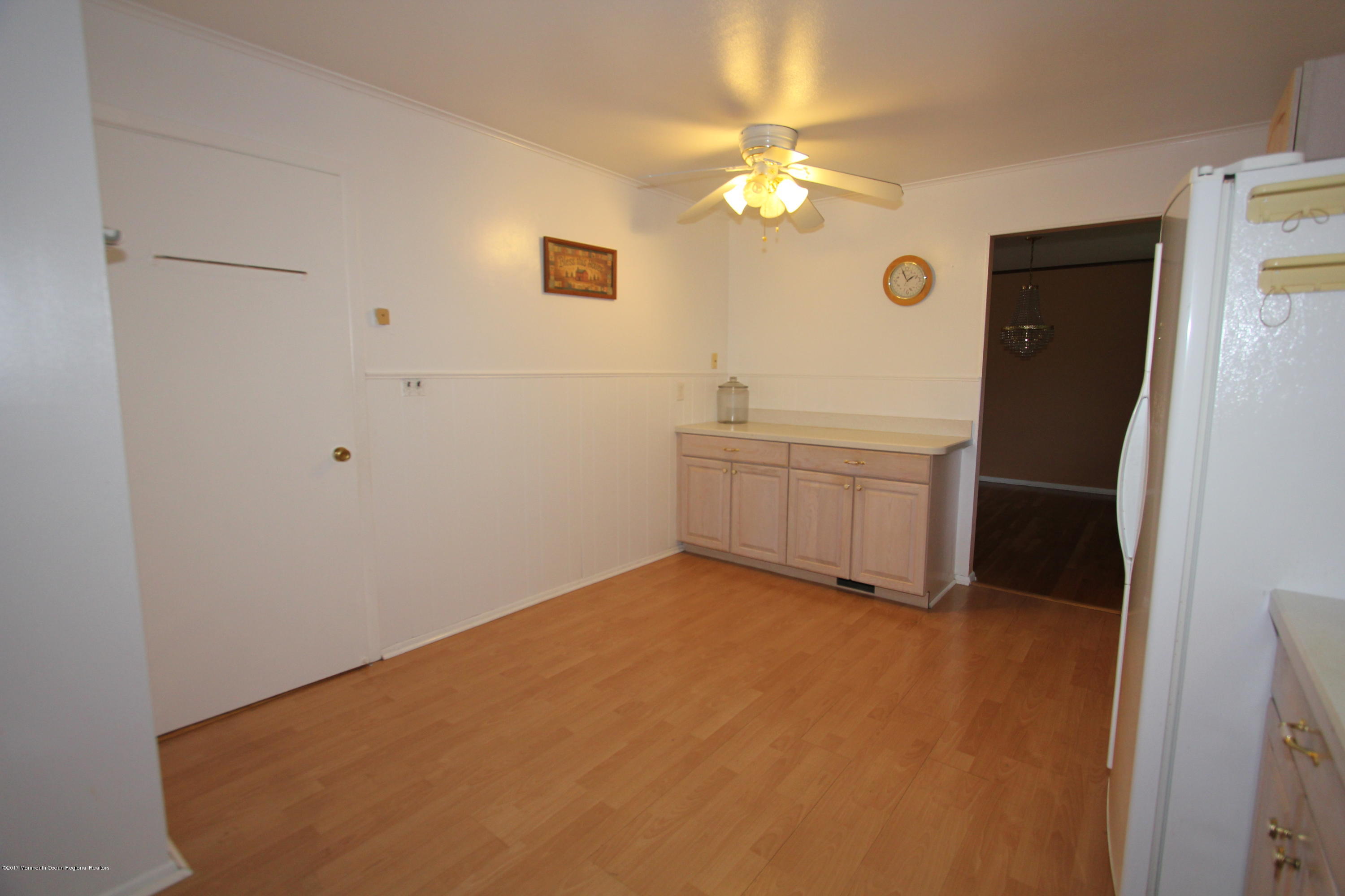 904 Fordham Road Neptune Township, NJ 07753 - Photo 7 of 24 a view of an empty room with chandelier fan