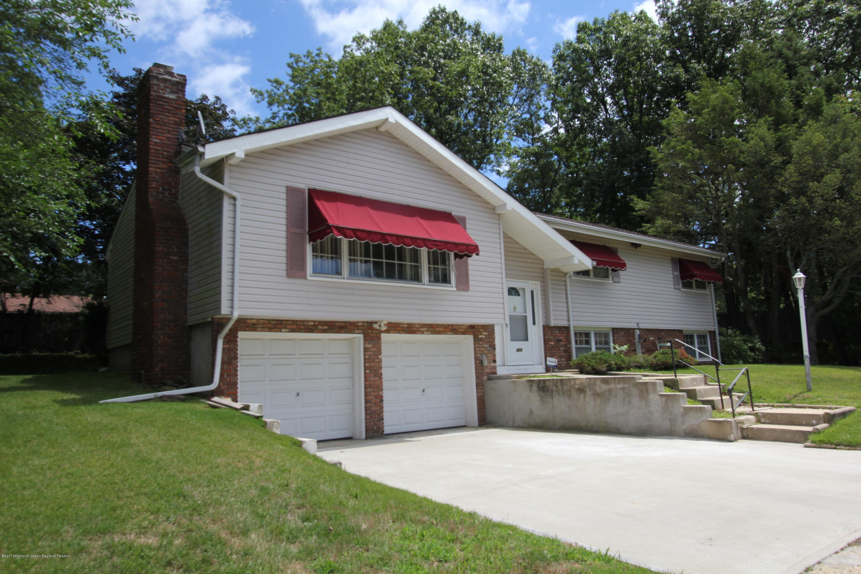 904 Fordham Road Neptune Township, NJ 07753 - Photo 8 of 24 a view of a house with a yard and a large tree