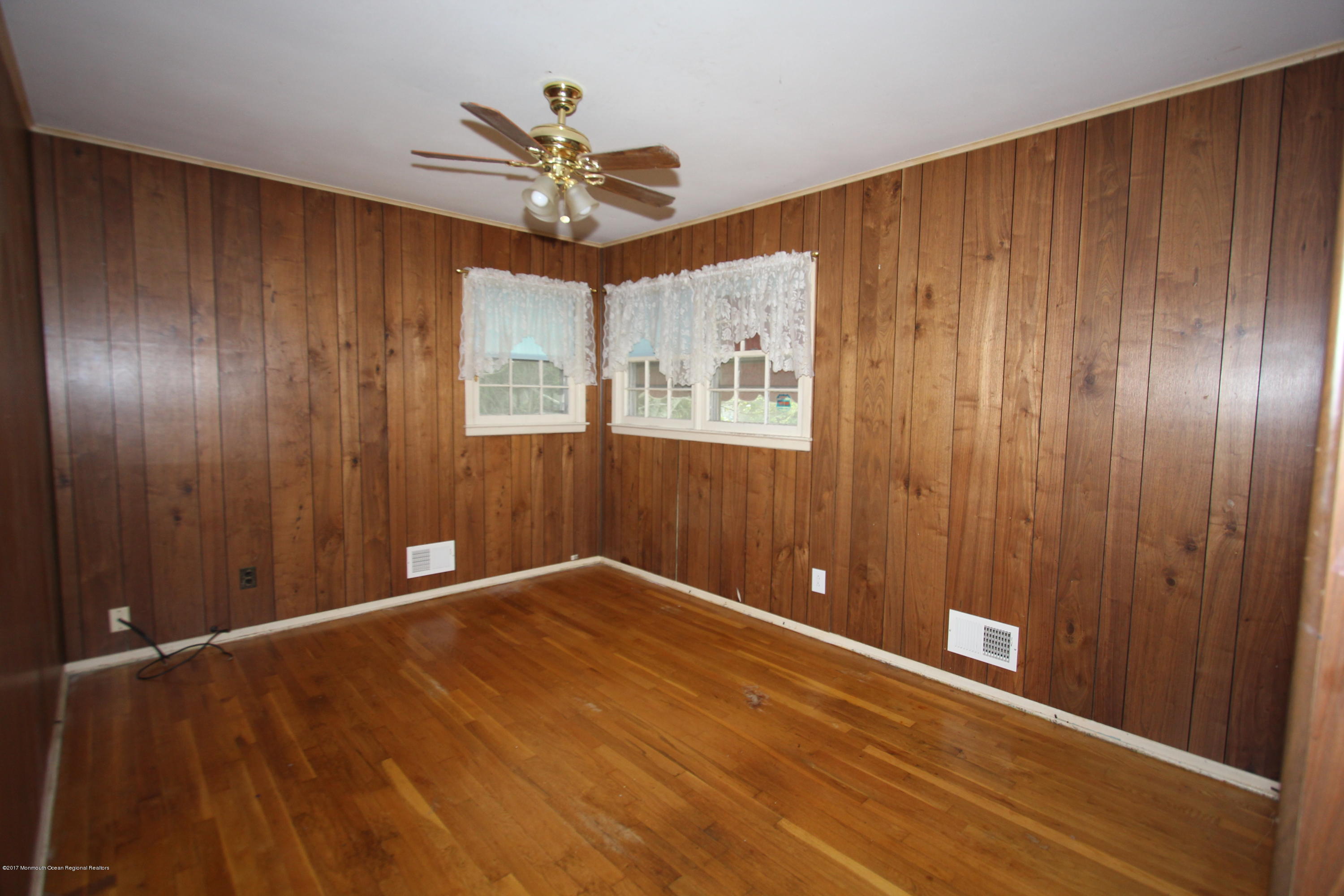 904 Fordham Road Neptune Township, NJ 07753 - Photo 10 of 24 a view of an empty room with a window
