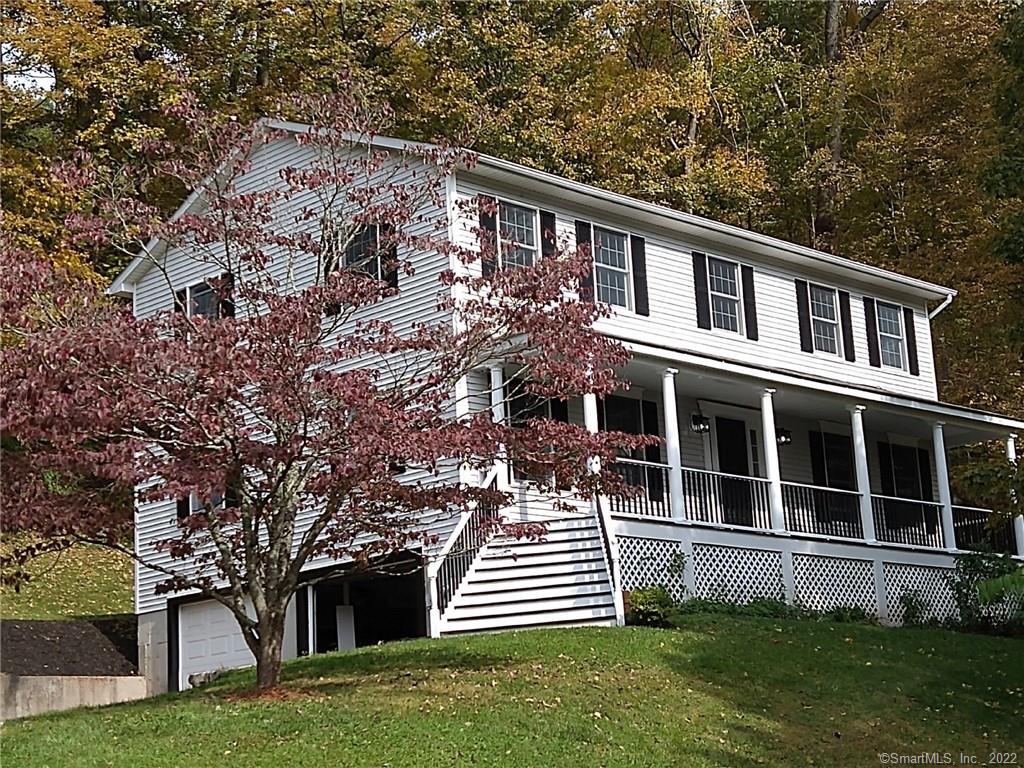 21 Joes Hill Road Danbury, CT 06811 - Photo 1 of 1 a front view of a house with a yard