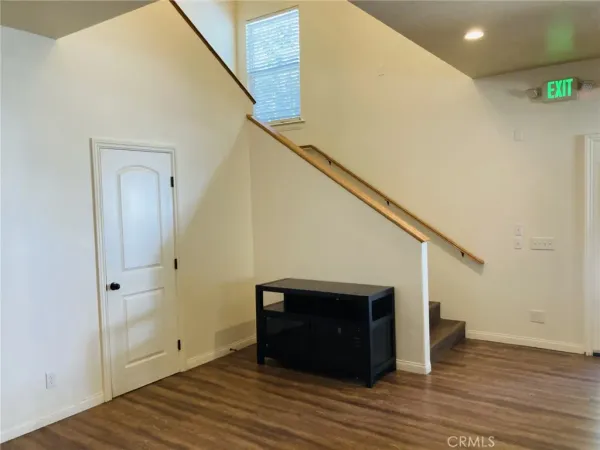 a view of a livingroom with wooden floor
