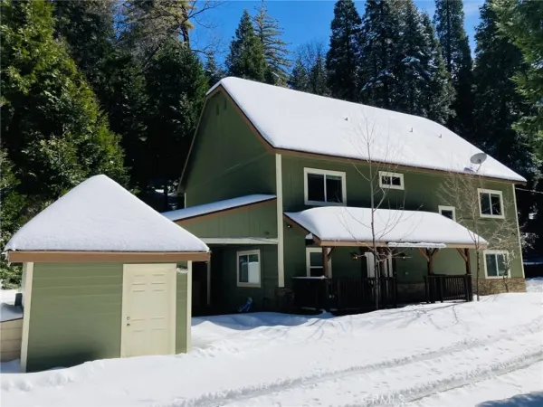 a front view of a house with a patio