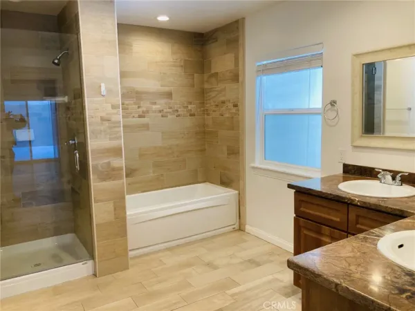 a bathroom with a glass shower door