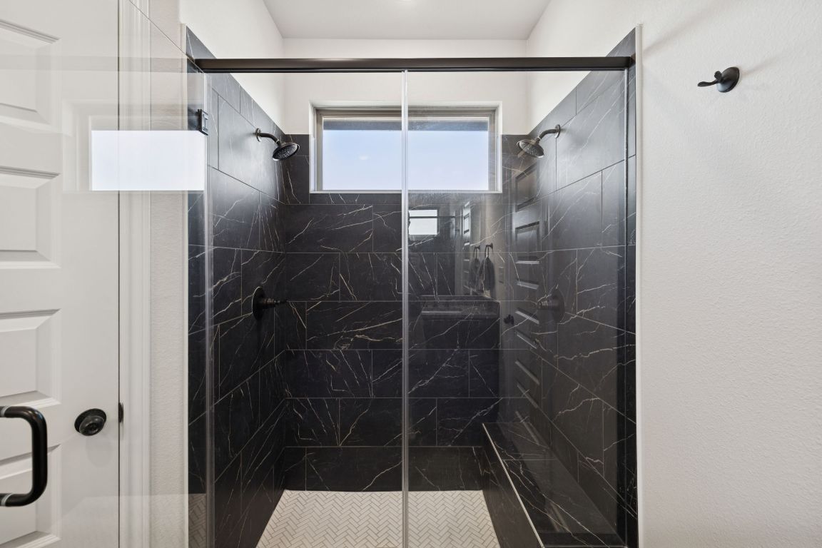 108 Santa Teresa Road Kyle, TX 78640 - Photo 14 of 26 a bathroom with a shower