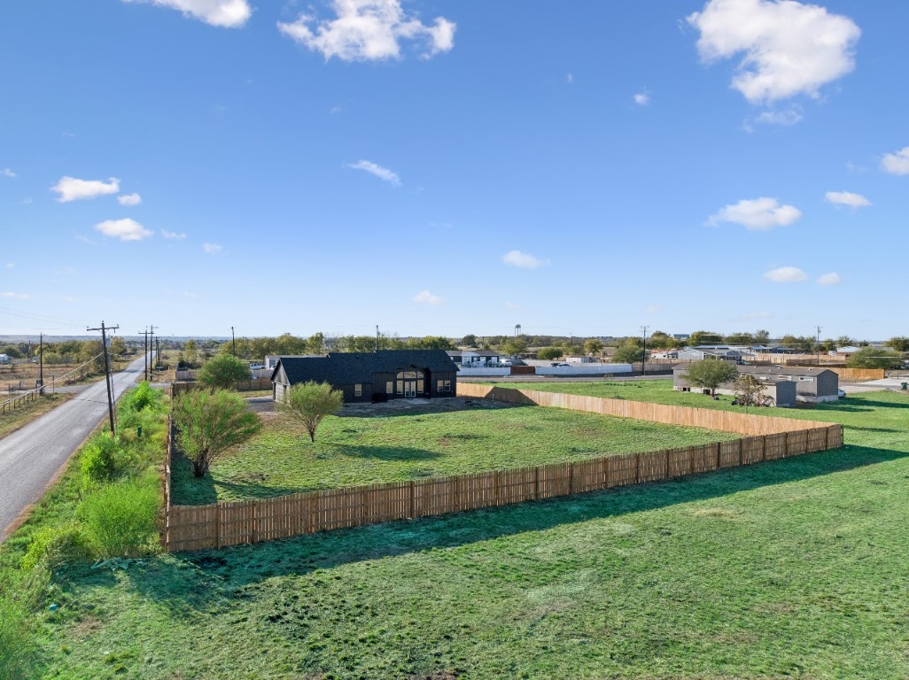 108 Santa Teresa Road Kyle, TX 78640 - Photo 22 of 26 a view of a lake with a big yard