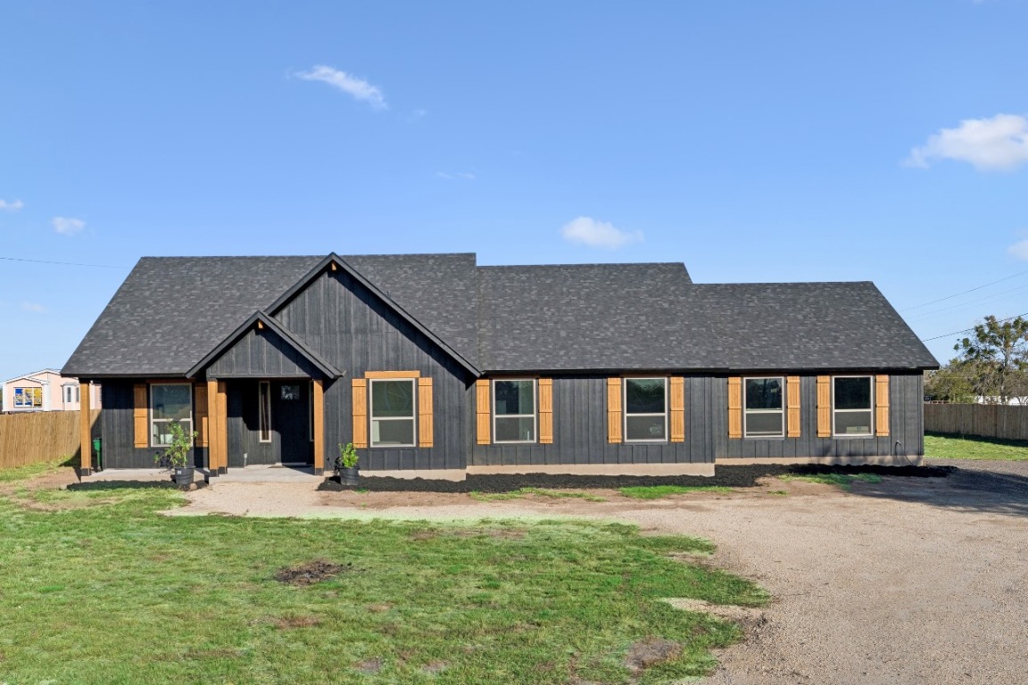 108 Santa Teresa Road Kyle, TX 78640 - Photo 3 of 26 a front view of a house with a yard