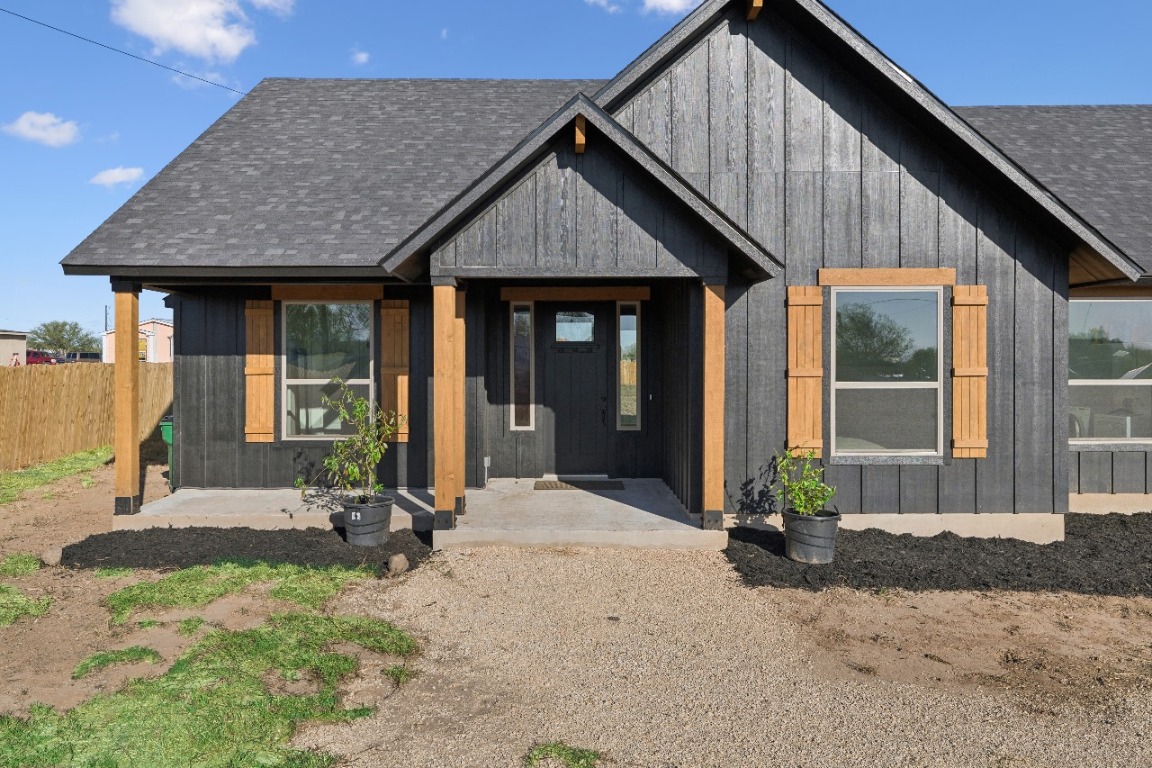 108 Santa Teresa Road Kyle, TX 78640 - Photo 4 of 26 a front view of a house with a yard