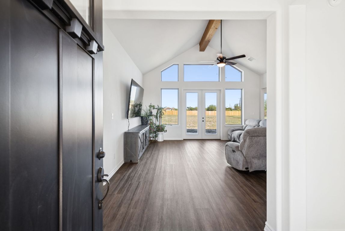 108 Santa Teresa Road Kyle, TX 78640 - Photo 5 of 26 a view of a hallway with wooden floor and furniture