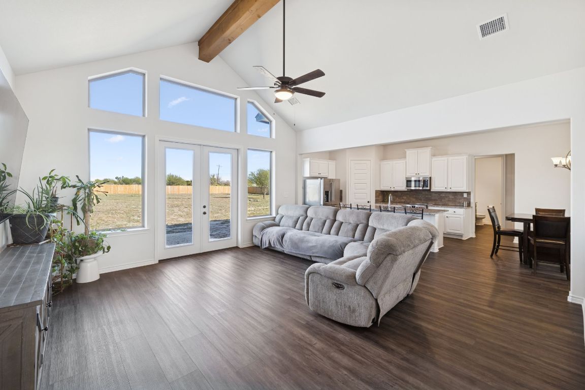 108 Santa Teresa Road Kyle, TX 78640 - Photo 6 of 26 a living room with furniture and a large window