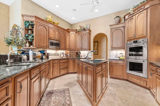 a view of a dining room with furniture a chandelier and wooden floor