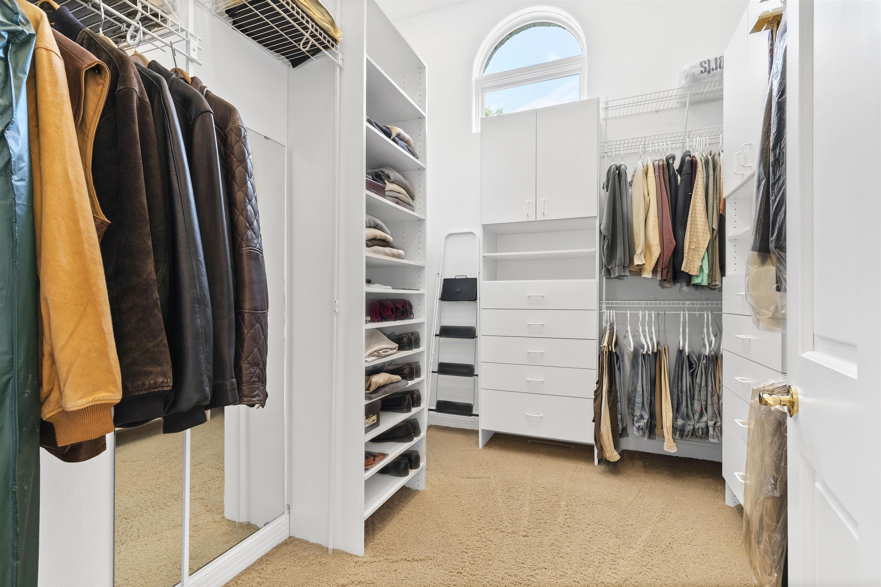 17278 Laube Road Davis, IL 61019 - Photo 21 of 97 a view of walk in closet with clothes and shoes