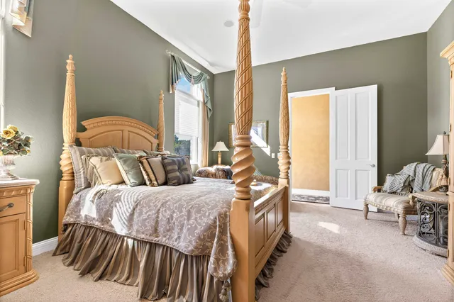 a view of a patio with a table chairs and garden