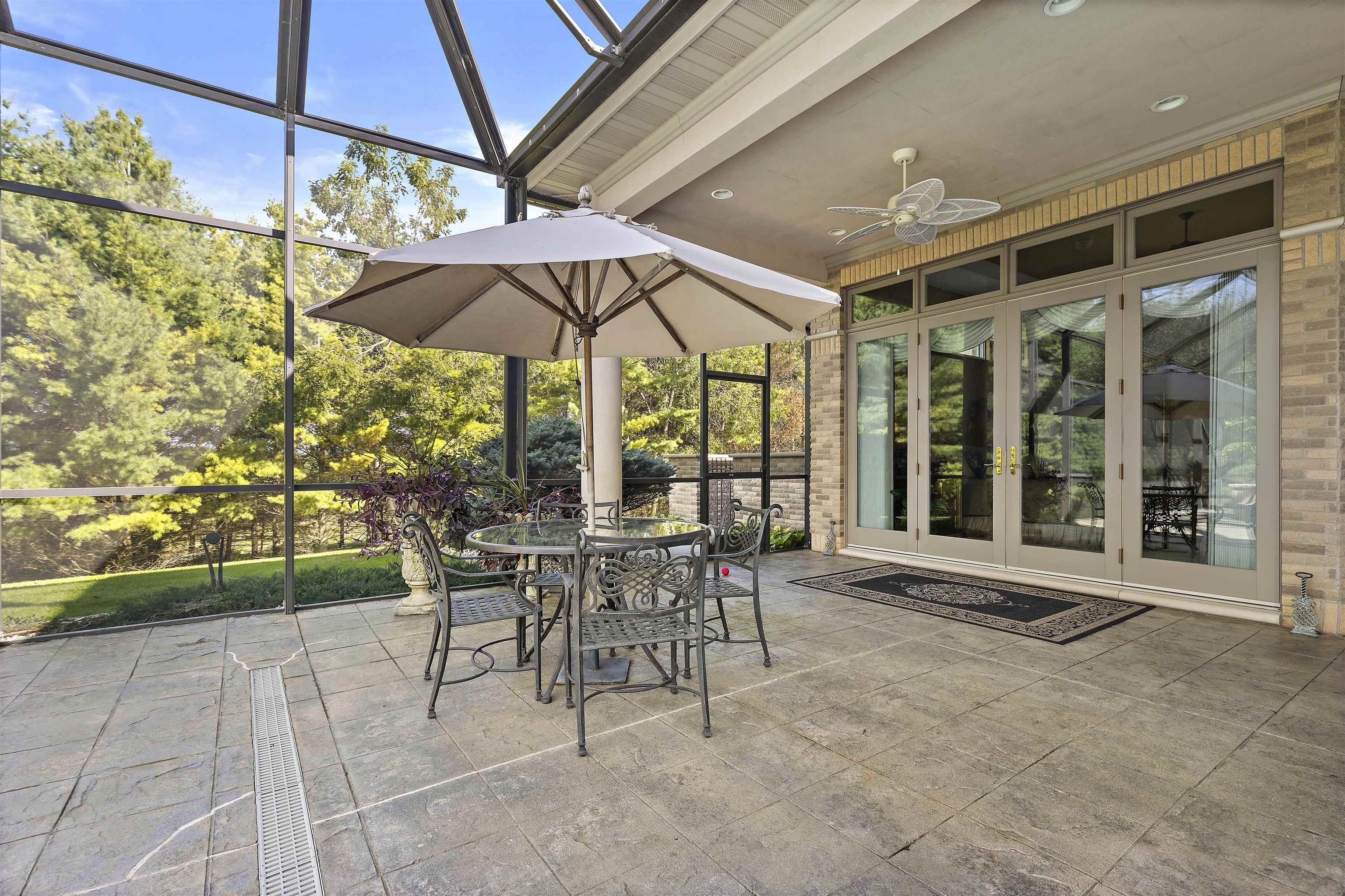17278 Laube Road Davis, IL 61019 - Photo 63 of 97 a view of a patio with a table and chairs under an umbrella