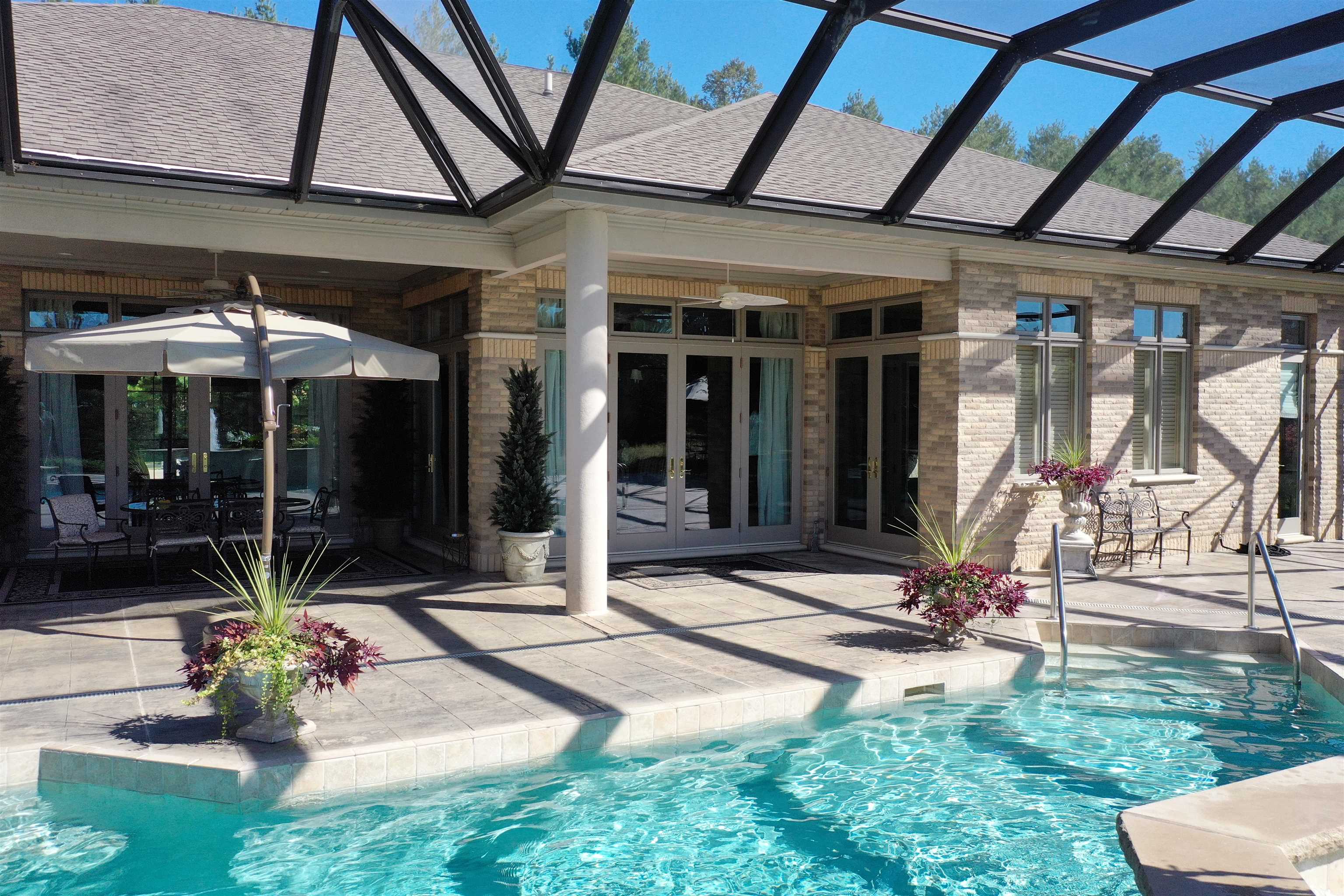 17278 Laube Road Davis, IL 61019 - Photo 67 of 97 a view of the patio with a table and chairs under an umbrella