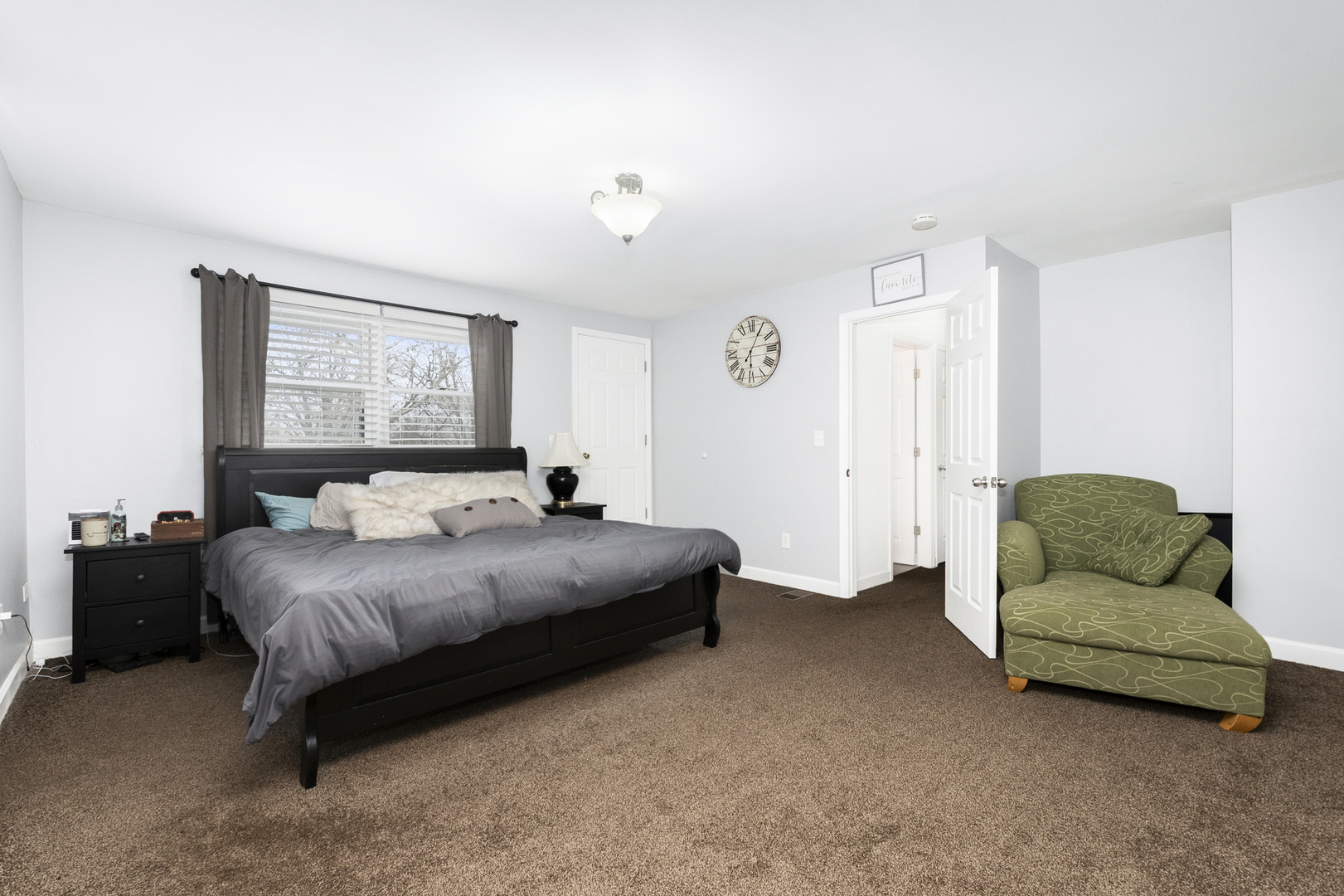 307 North Raven Road Shorewood, IL 60404 - Photo 14 of 22 a spacious bedroom with a bed and a couch