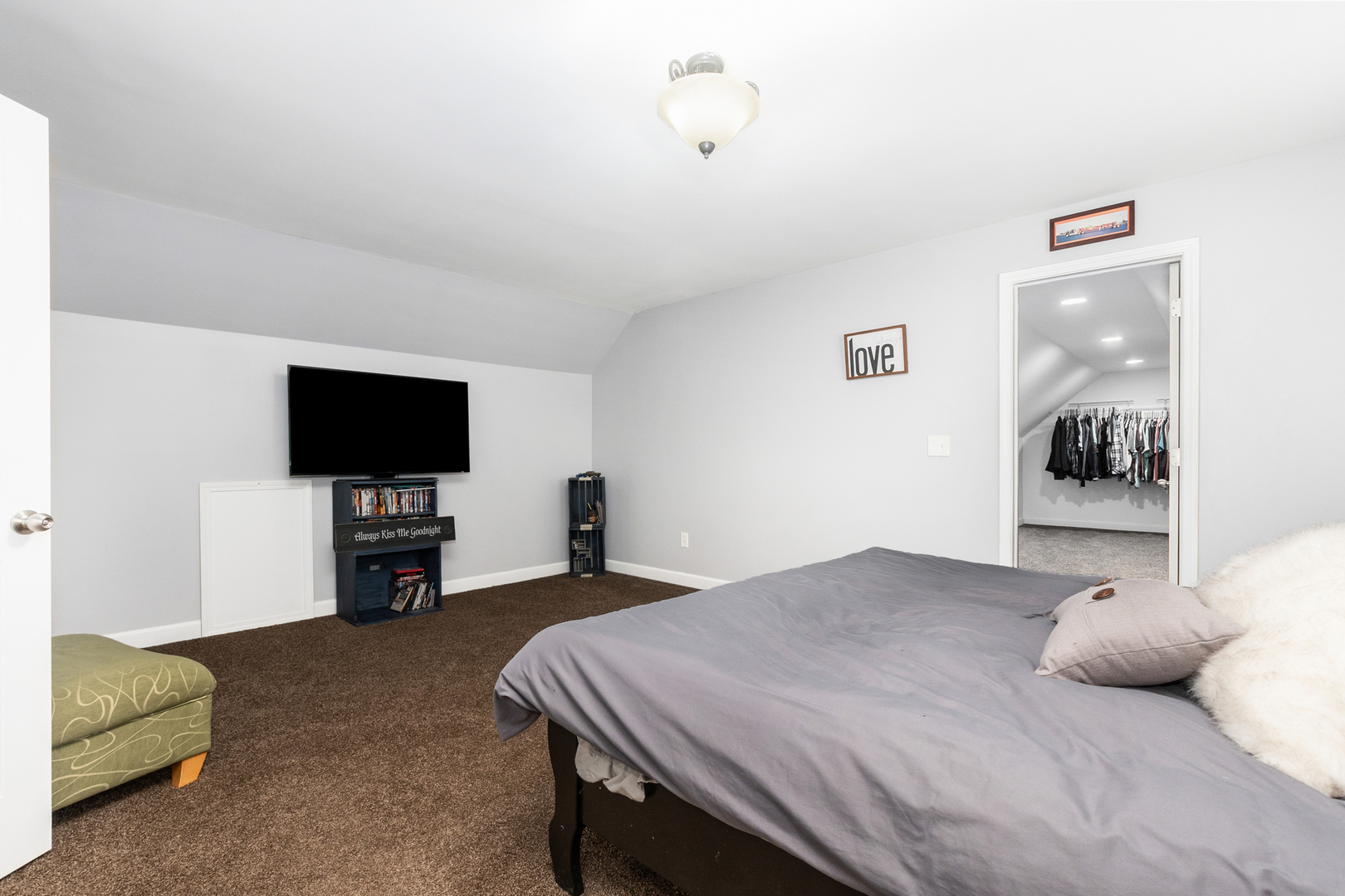 307 North Raven Road Shorewood, IL 60404 - Photo 15 of 22 a bedroom with a bed and a flat screen tv