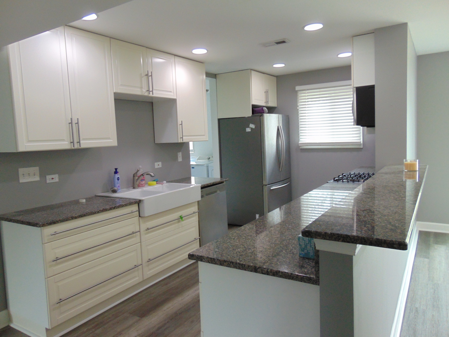 307 North Raven Road Shorewood, IL 60404 - Photo 5 of 22 a kitchen with stainless steel appliances granite countertop a refrigerator a sink and a stove