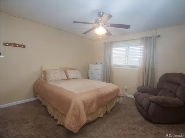 a bedroom with bed and window