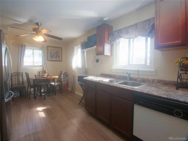 a kitchen with lots of counter space and dining table