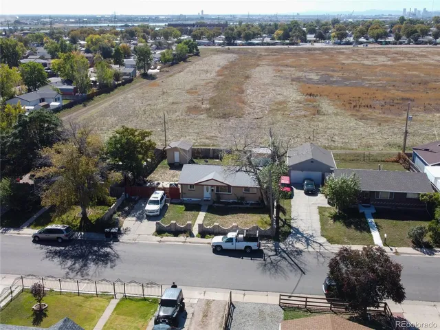 an aerial view of a house with a lake view