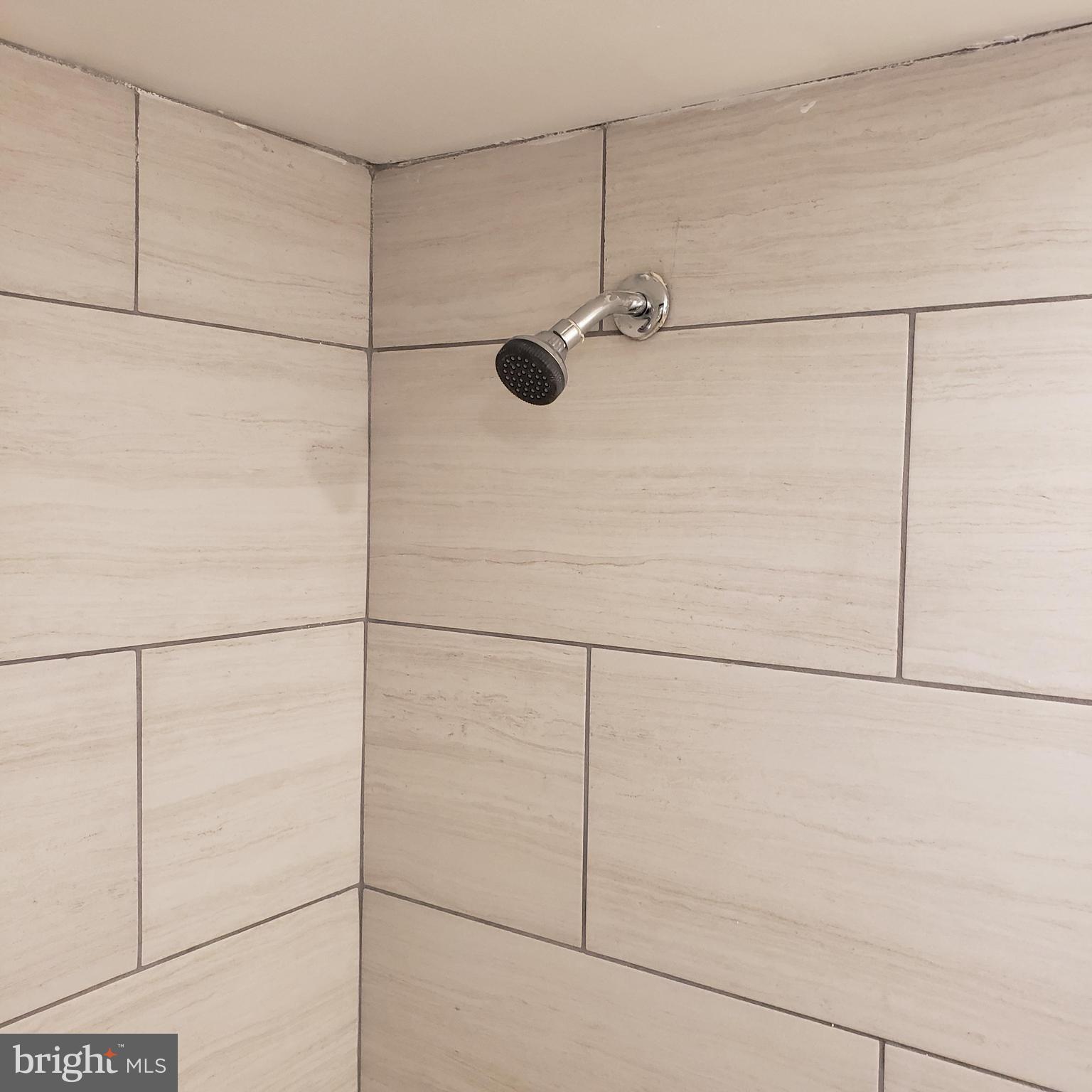 4116 Garrison Boulevard Baltimore, MD 21215 - Photo 12 of 23 a bathroom with a shower