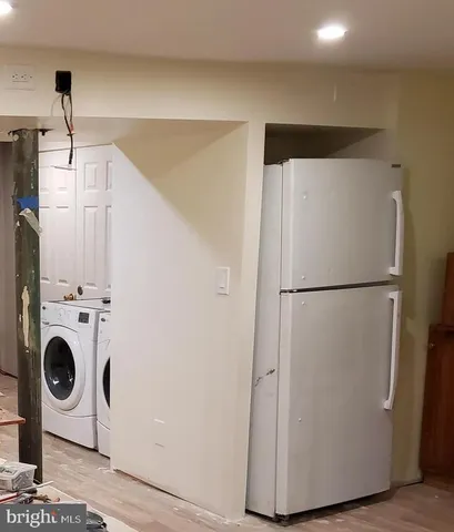 a room with wooden floor and shoes