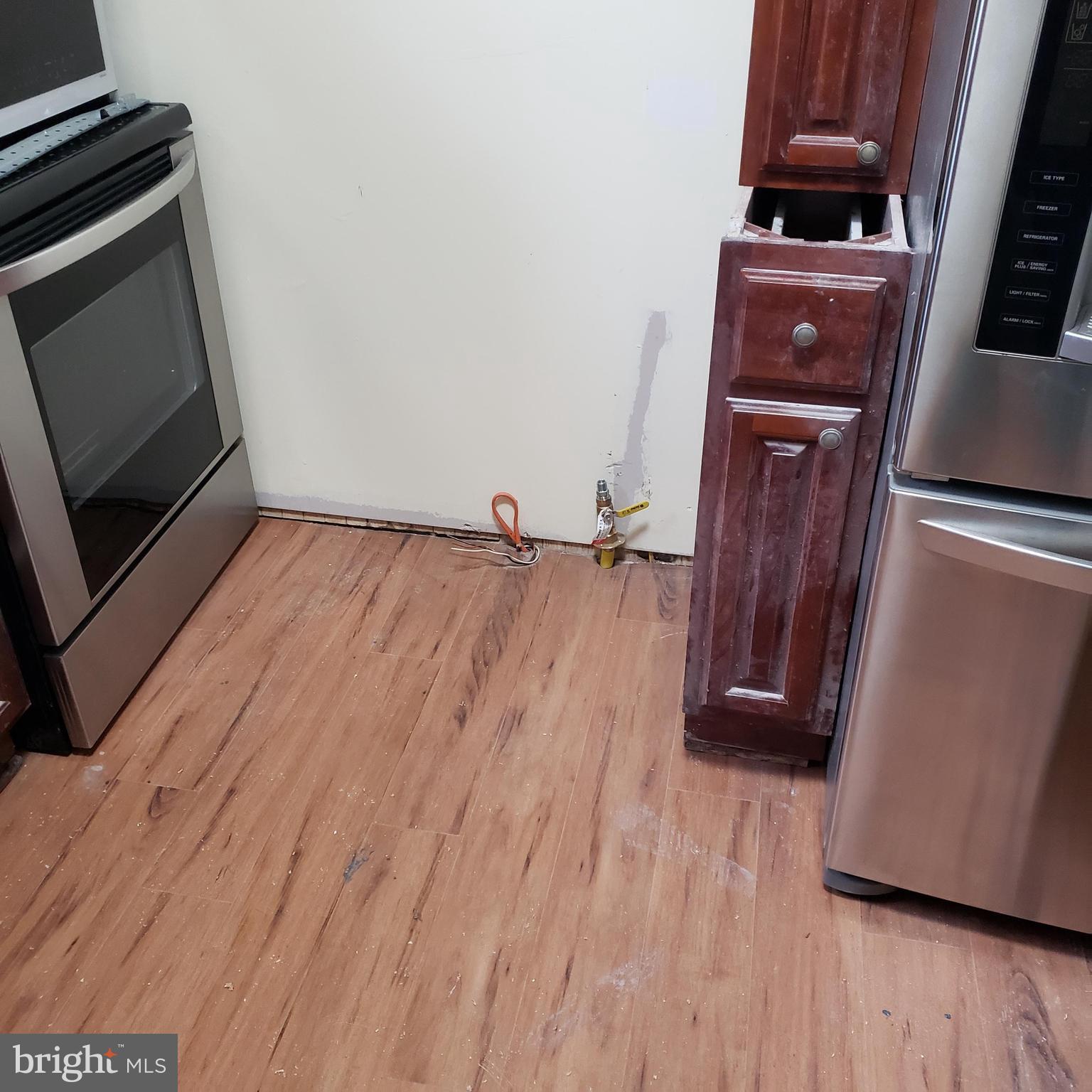 4116 Garrison Boulevard Baltimore, MD 21215 - Photo 10 of 23 a view of a room with wooden floor and a fireplace