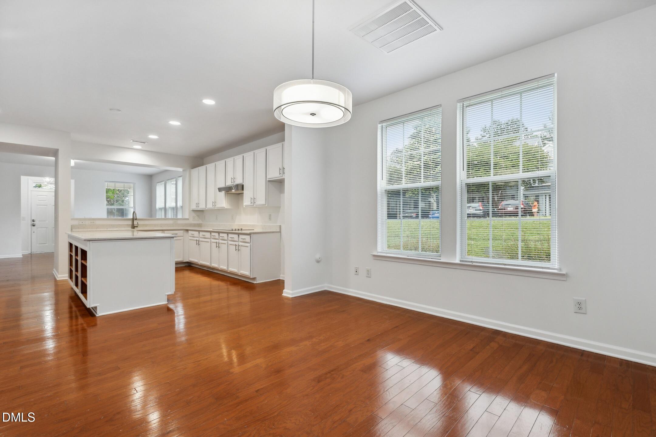 3141 Rapid Falls Road Cary, NC 27519 - Photo 13 of 28 a view of kitchen with granite countertop window and wooden floor