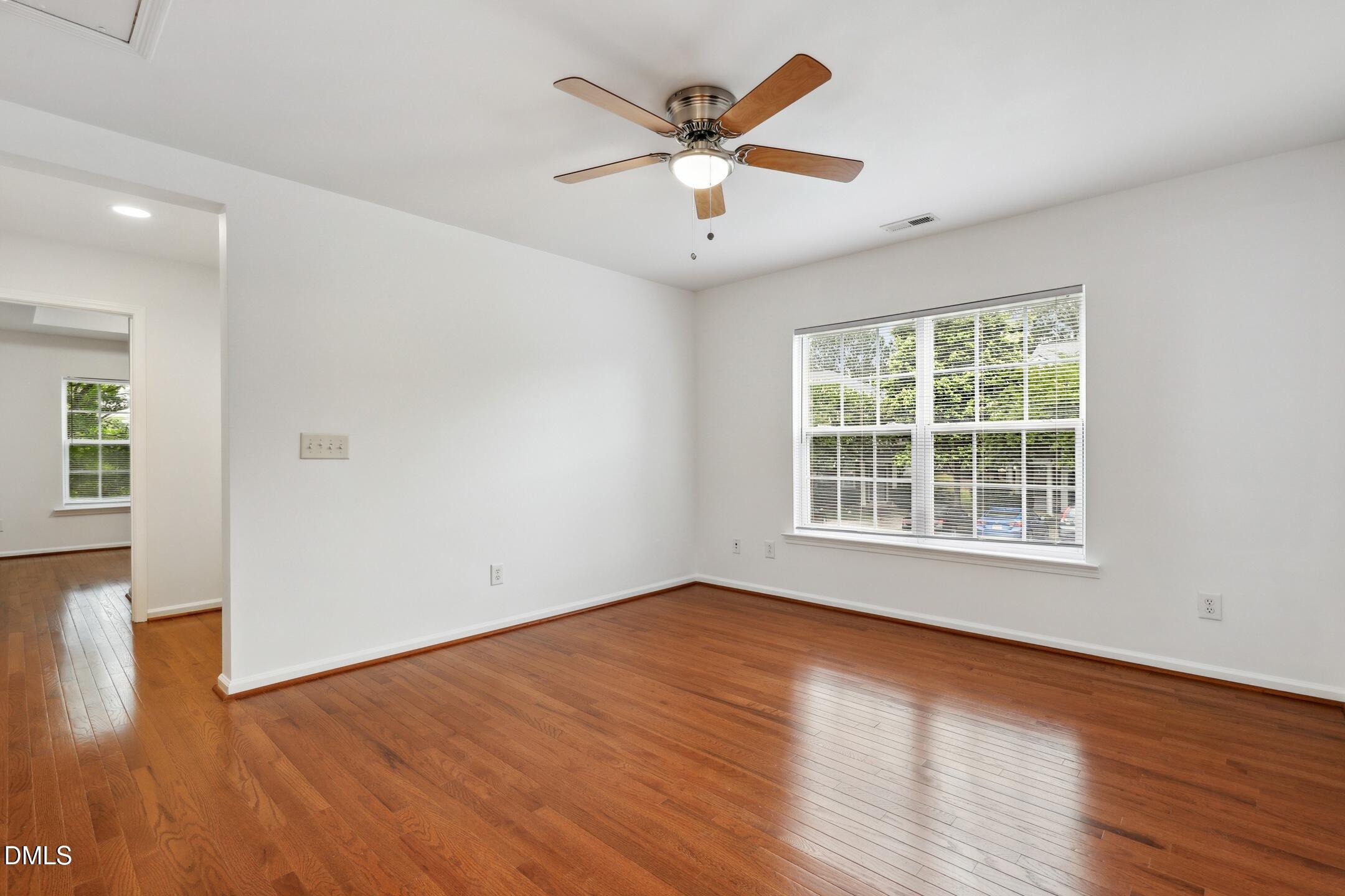 3141 Rapid Falls Road Cary, NC 27519 - Photo 15 of 28 an empty room with wooden floor and windows