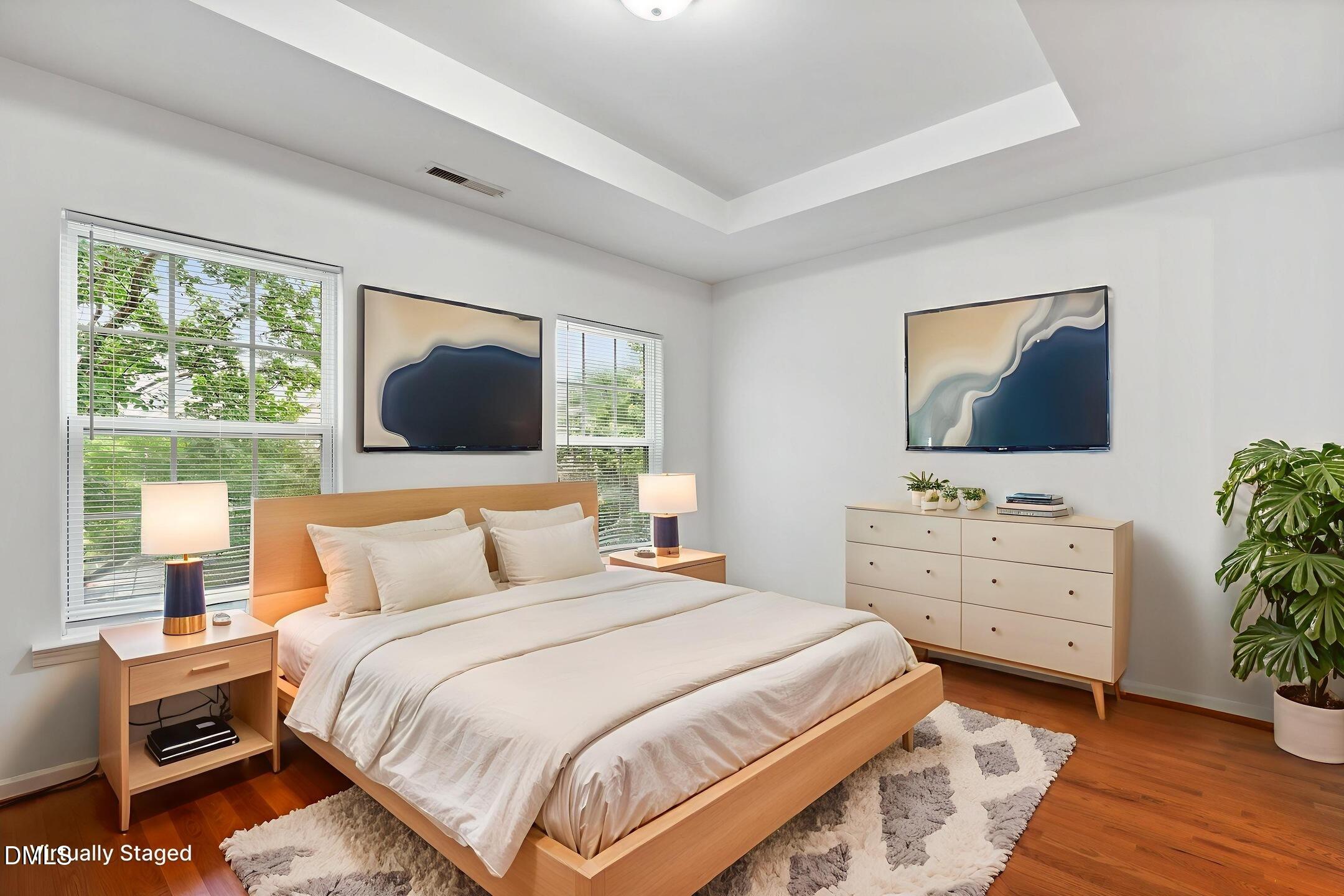 3141 Rapid Falls Road Cary, NC 27519 - Photo 18 of 28 a bedroom with a bed and a flat screen tv