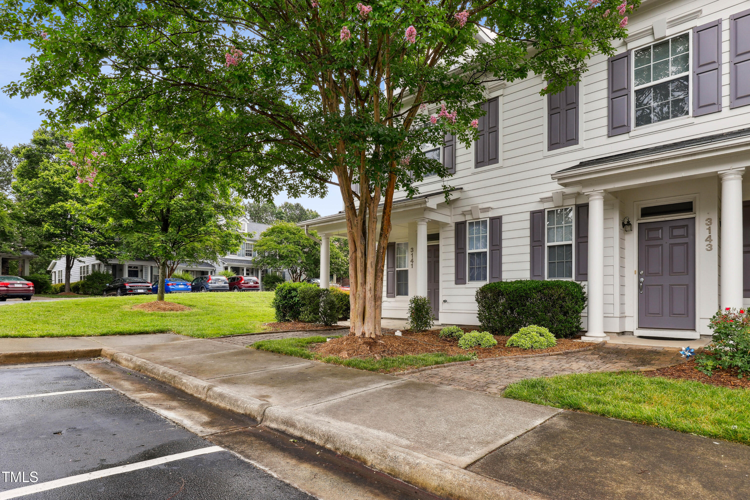 3141 Rapid Falls Road Cary, NC 27519 - Photo 2 of 28 a front view of a house with a yard and trees