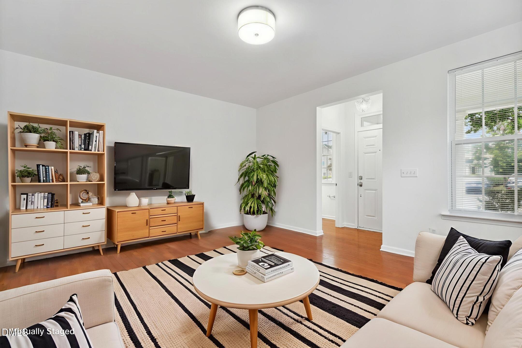 3141 Rapid Falls Road Cary, NC 27519 - Photo 5 of 28 a living room with furniture and a flat screen tv