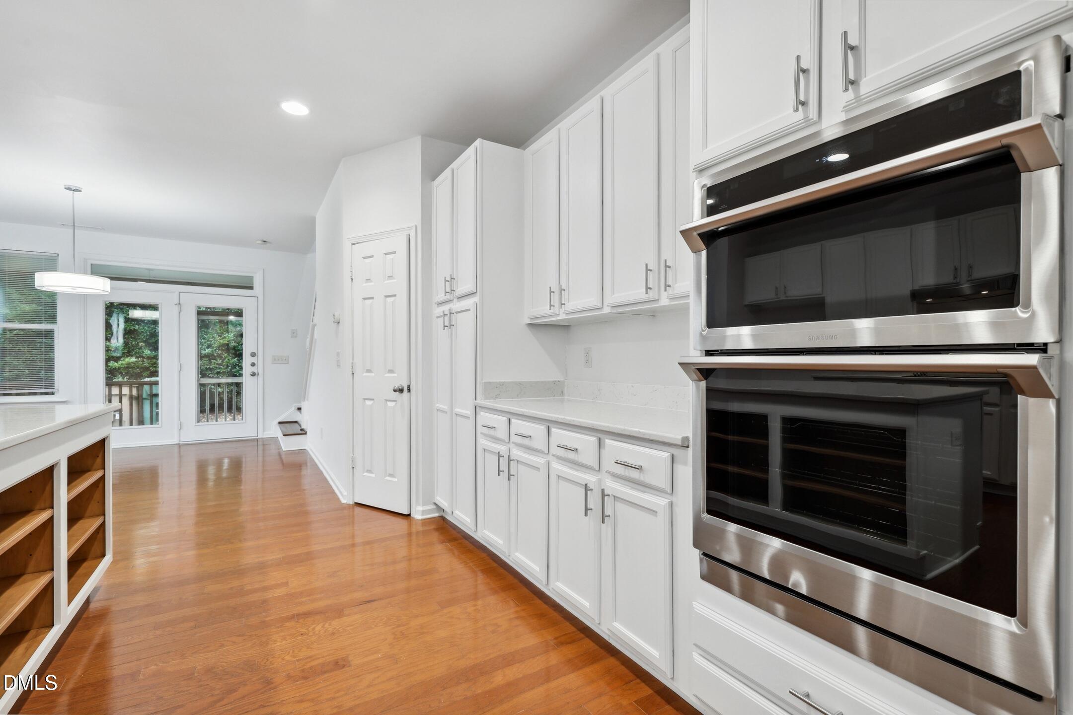 3141 Rapid Falls Road Cary, NC 27519 - Photo 6 of 28 a kitchen with stainless steel appliances a stove a microwave and cabinets