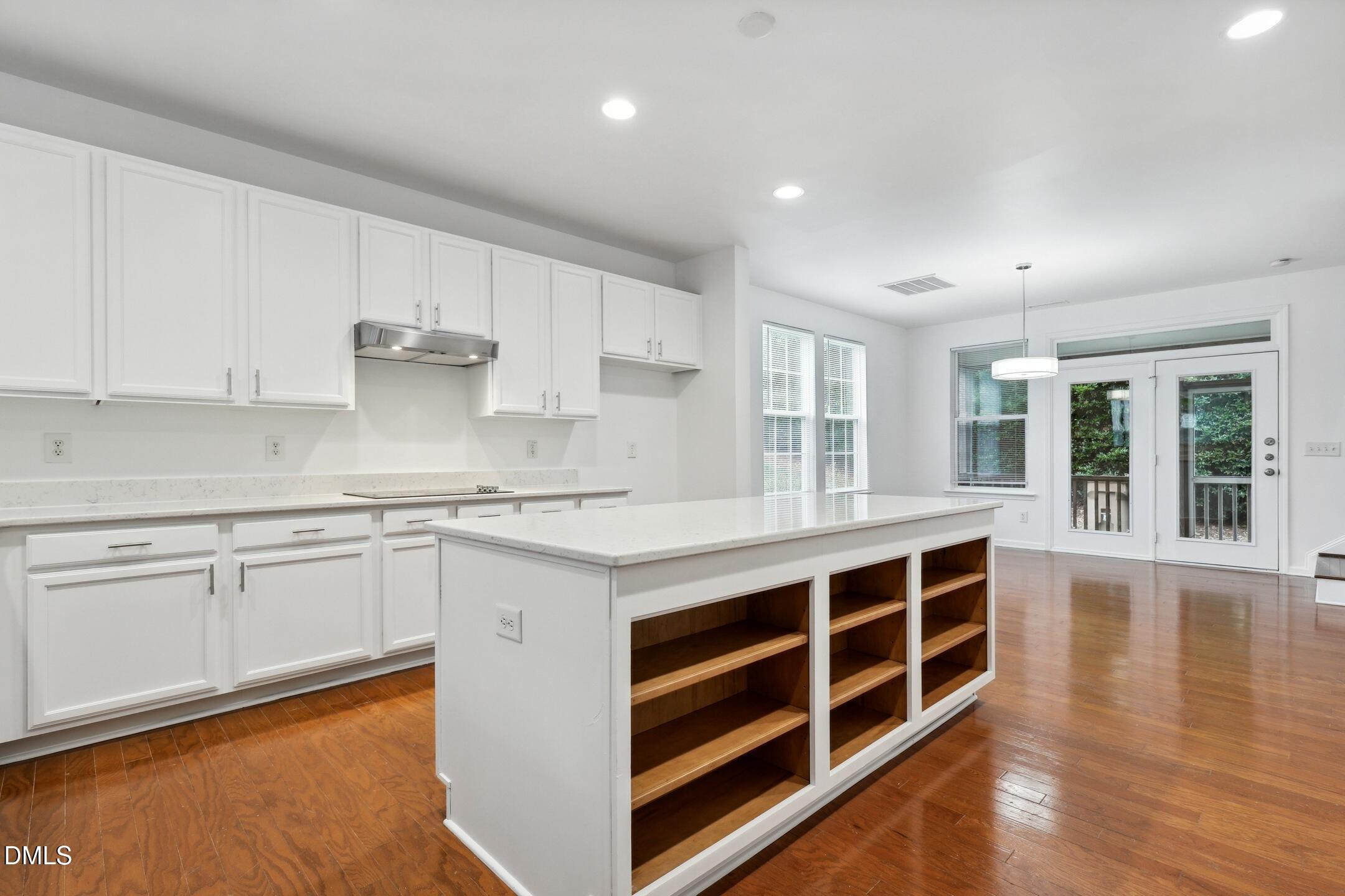 3141 Rapid Falls Road Cary, NC 27519 - Photo 7 of 28 a kitchen with stainless steel appliances granite countertop a stove and a sink
