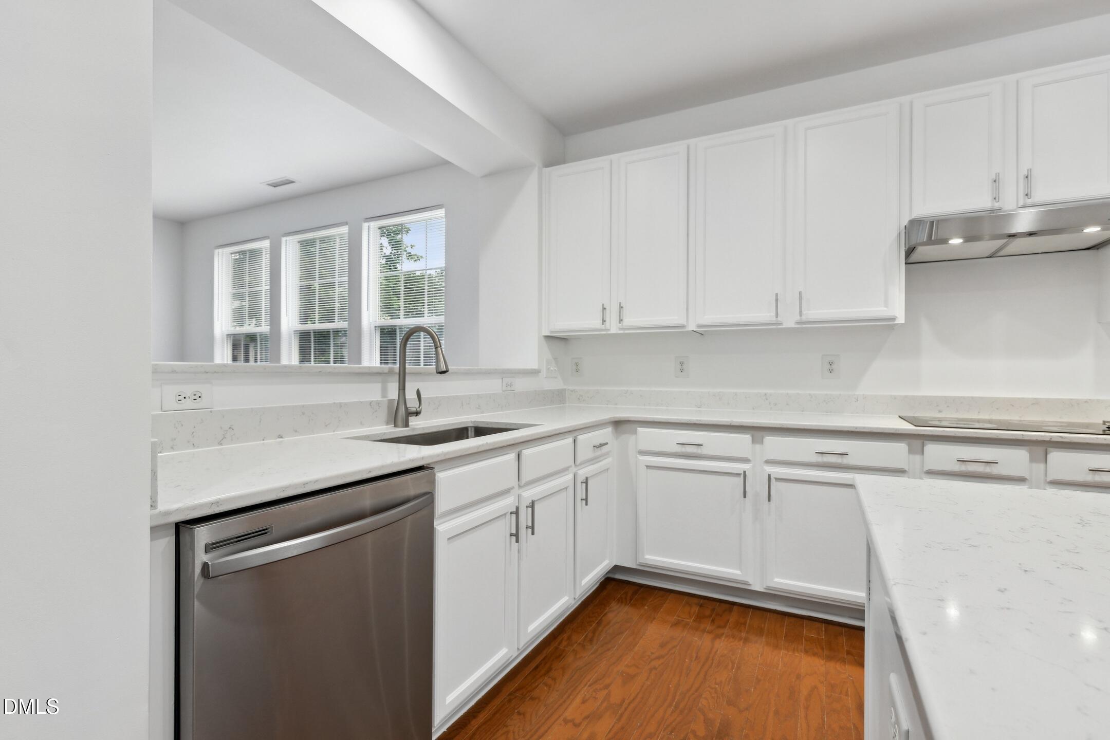 3141 Rapid Falls Road Cary, NC 27519 - Photo 8 of 28 a kitchen with stainless steel appliances granite countertop a sink stove and cabinets