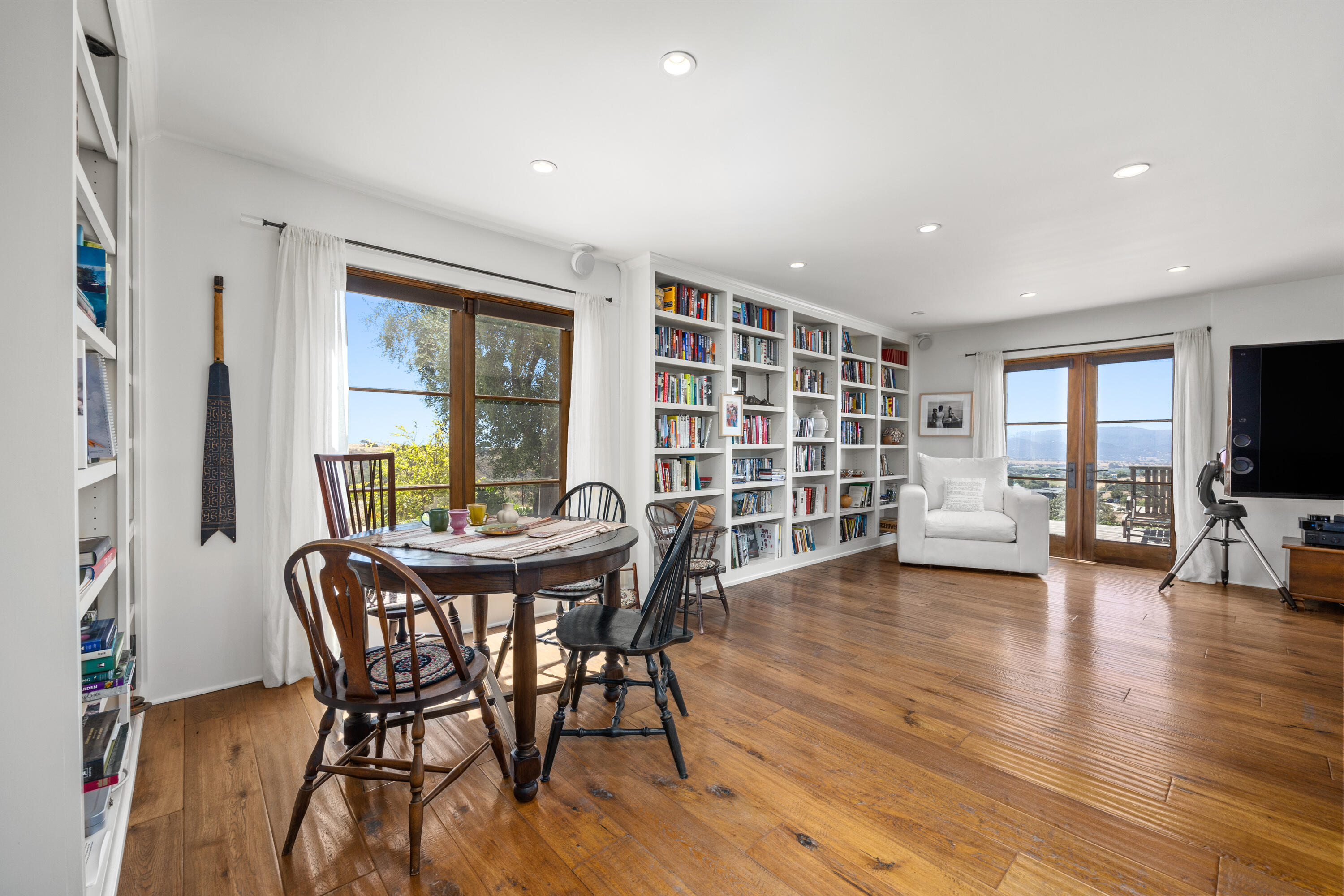 3001 Long Valley Road Santa Ynez, CA 93460 - Photo 19 of 52 a view of a dining room with furniture and a wooden floor