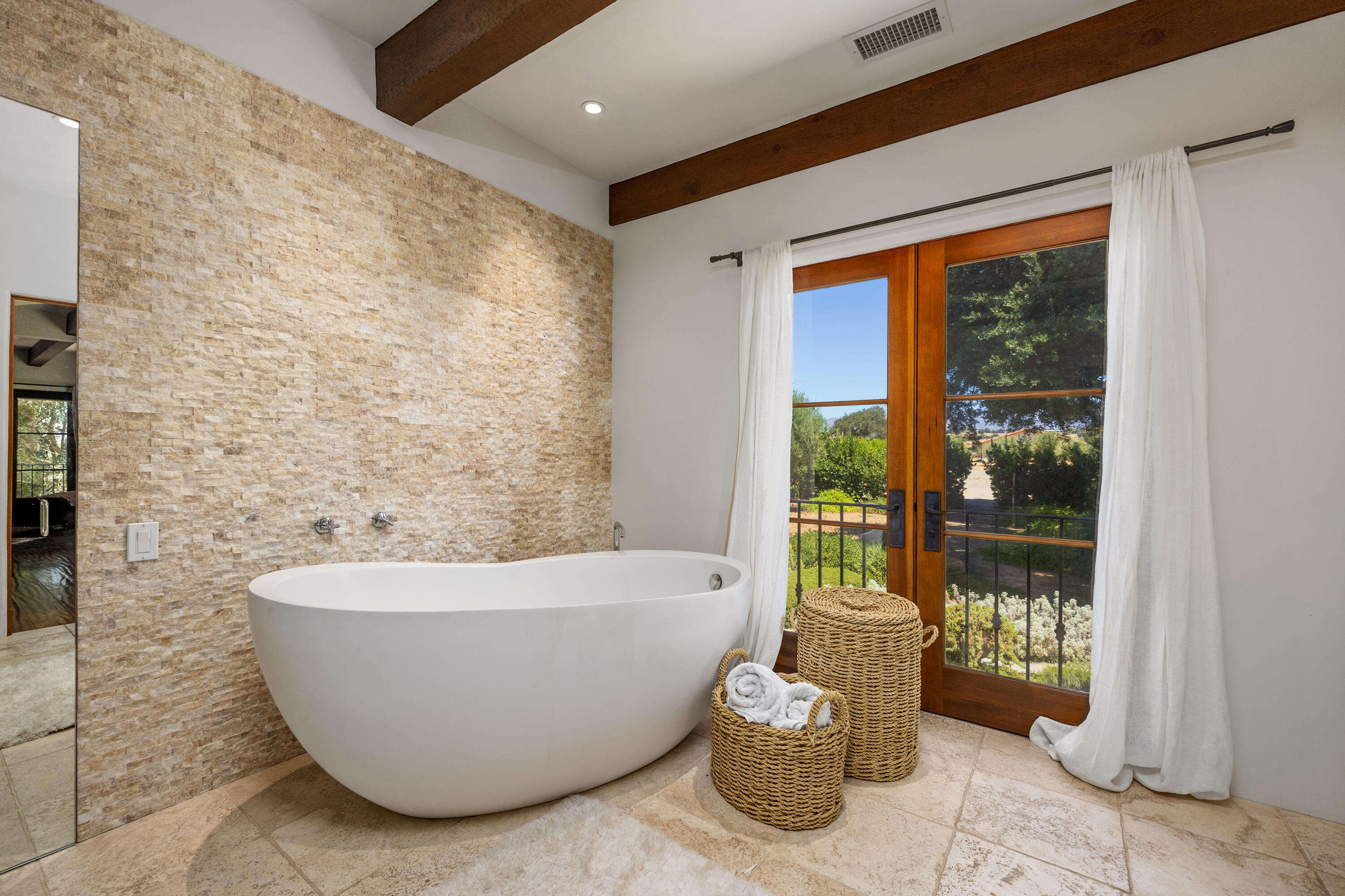 3001 Long Valley Road Santa Ynez, CA 93460 - Photo 23 of 52 a white bath tub sitting in front of a window