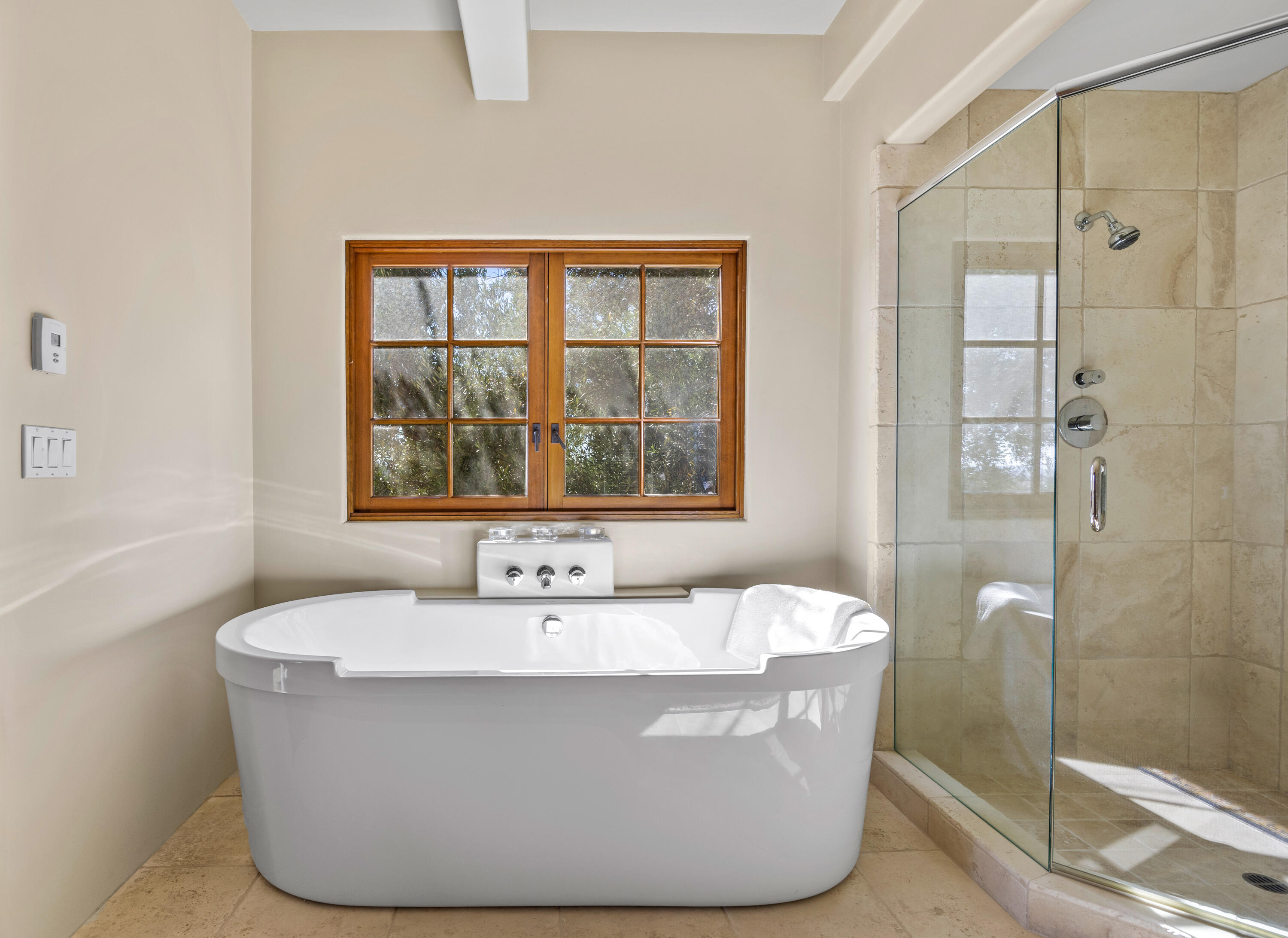 3001 Long Valley Road Santa Ynez, CA 93460 - Photo 29 of 52 a white bath tub sitting in a bathroom next to a window