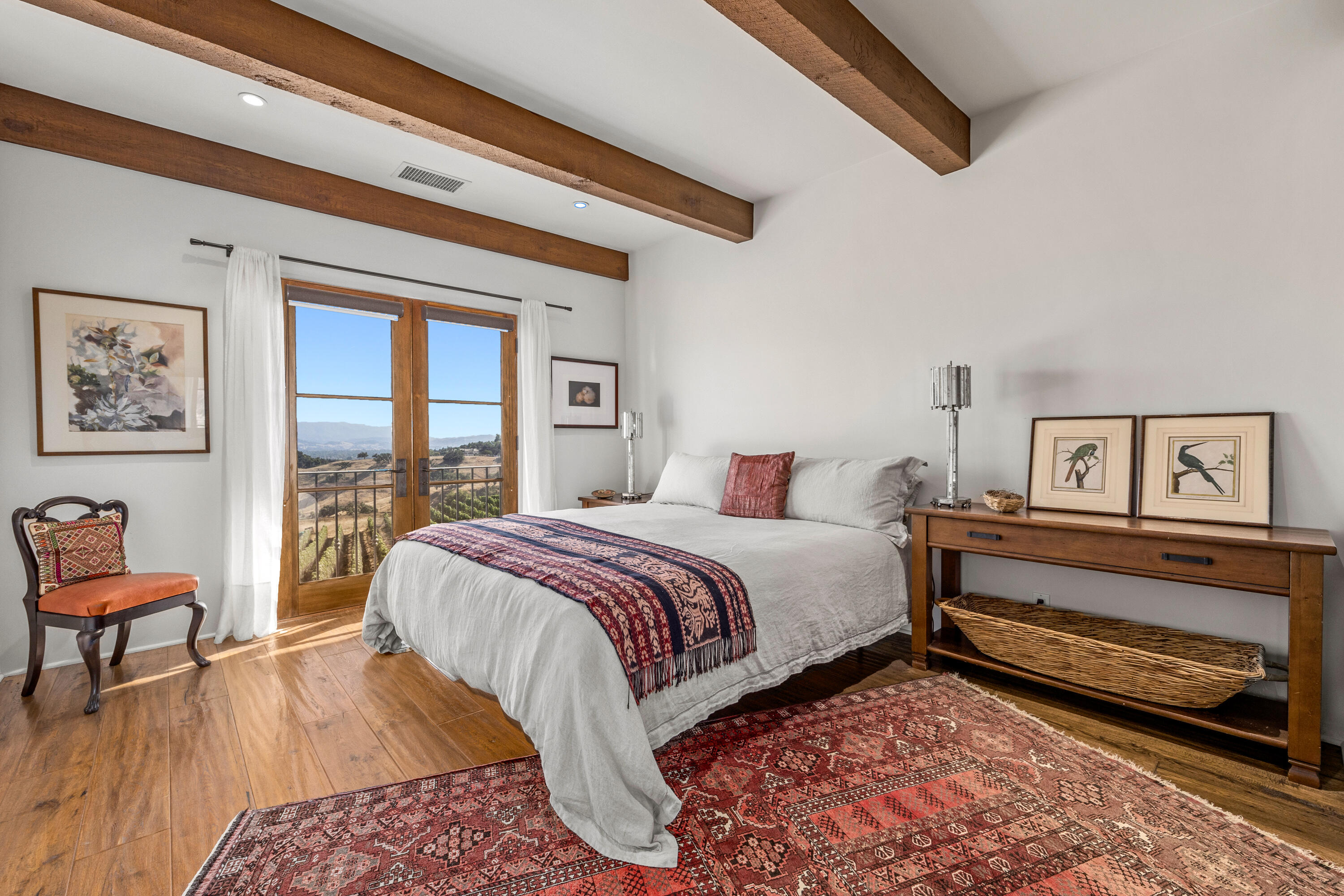 3001 Long Valley Road Santa Ynez, CA 93460 - Photo 30 of 52 a bedroom with a bed a bookshelf and a large window