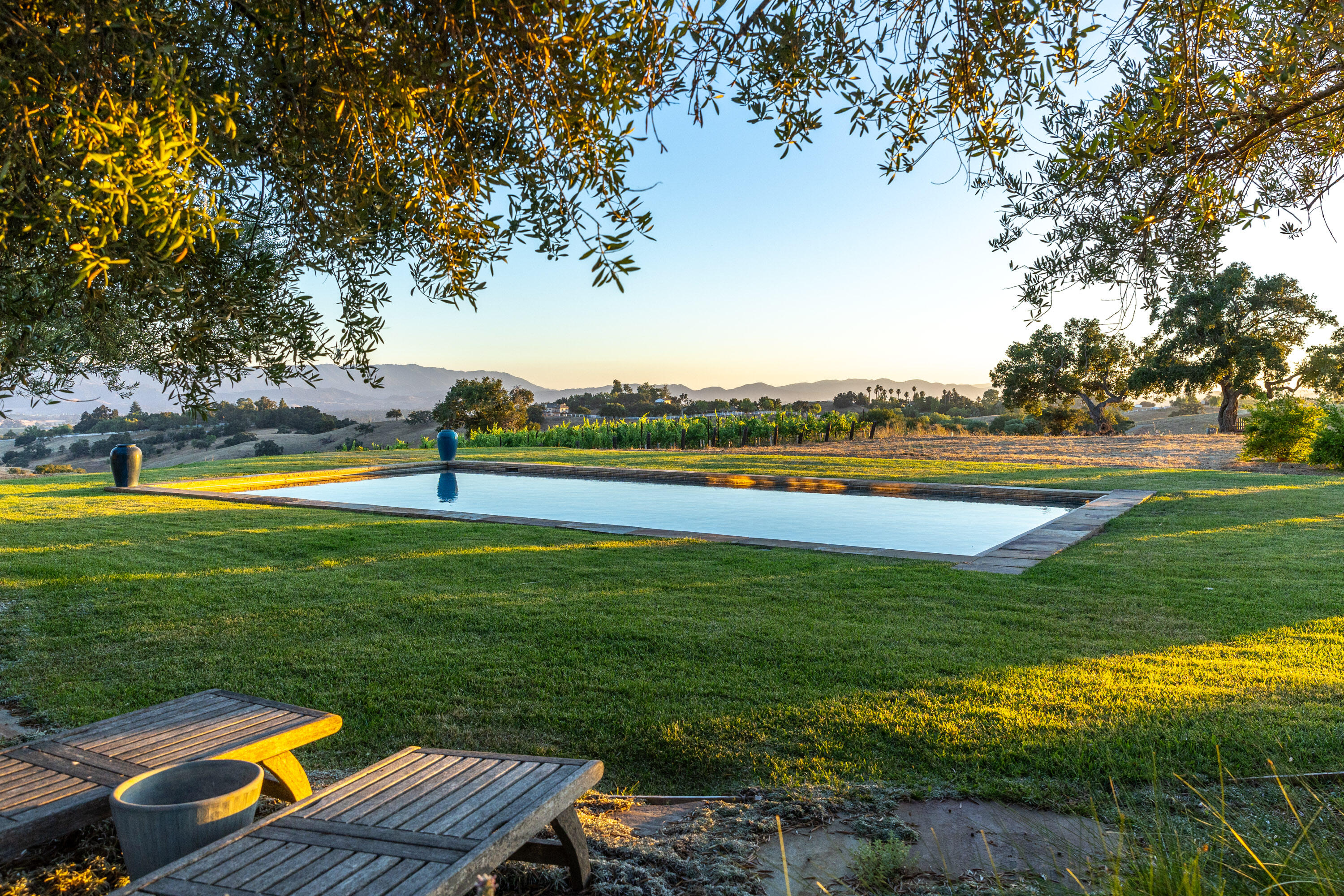 3001 Long Valley Road Santa Ynez, CA 93460 - Photo 32 of 52 a view of a swimming pool and lounge chairs in back yard