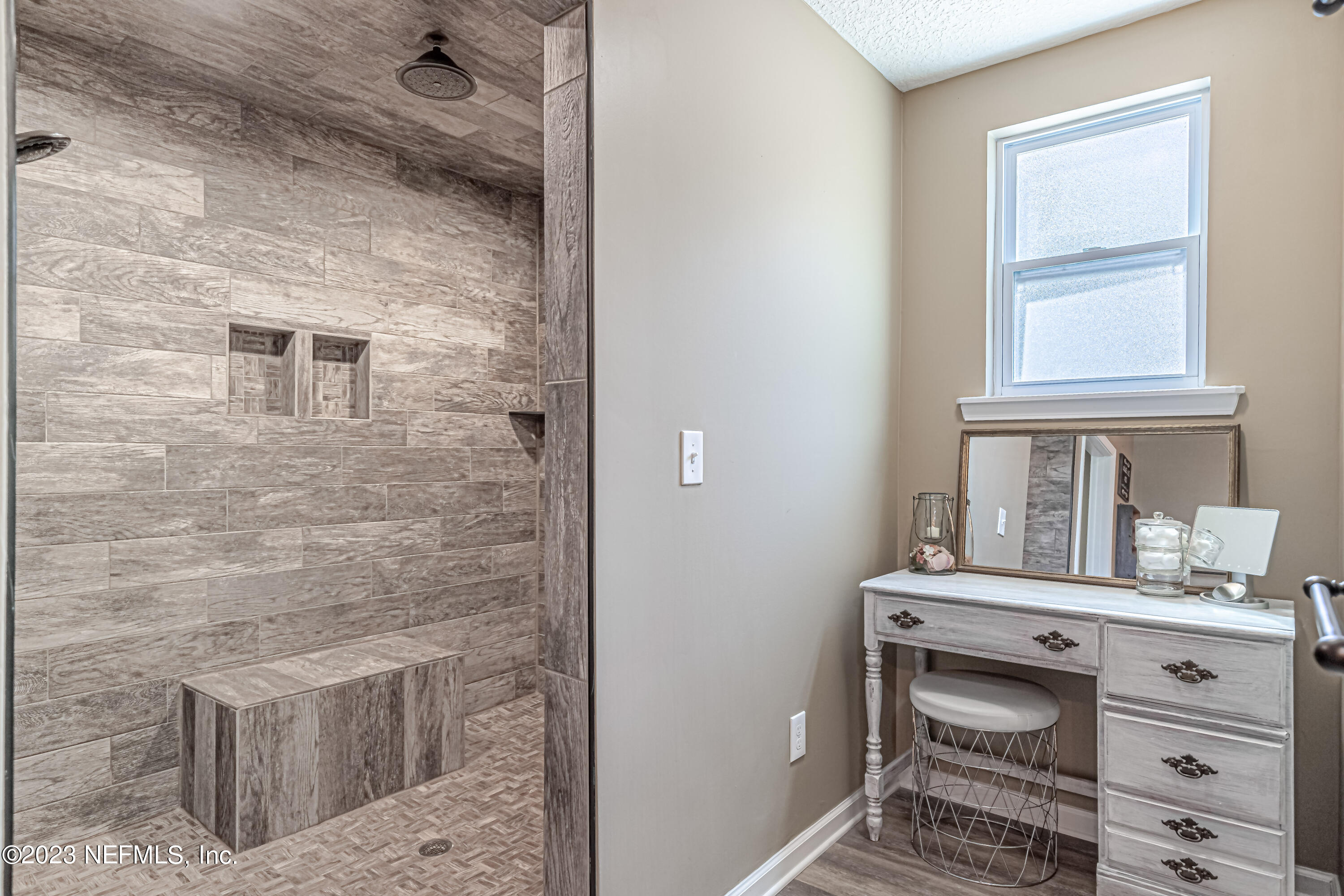 1199 Hatcher Road Middleburg, FL 32068 - Photo 32 of 55 a bathroom with a sink and a mirror