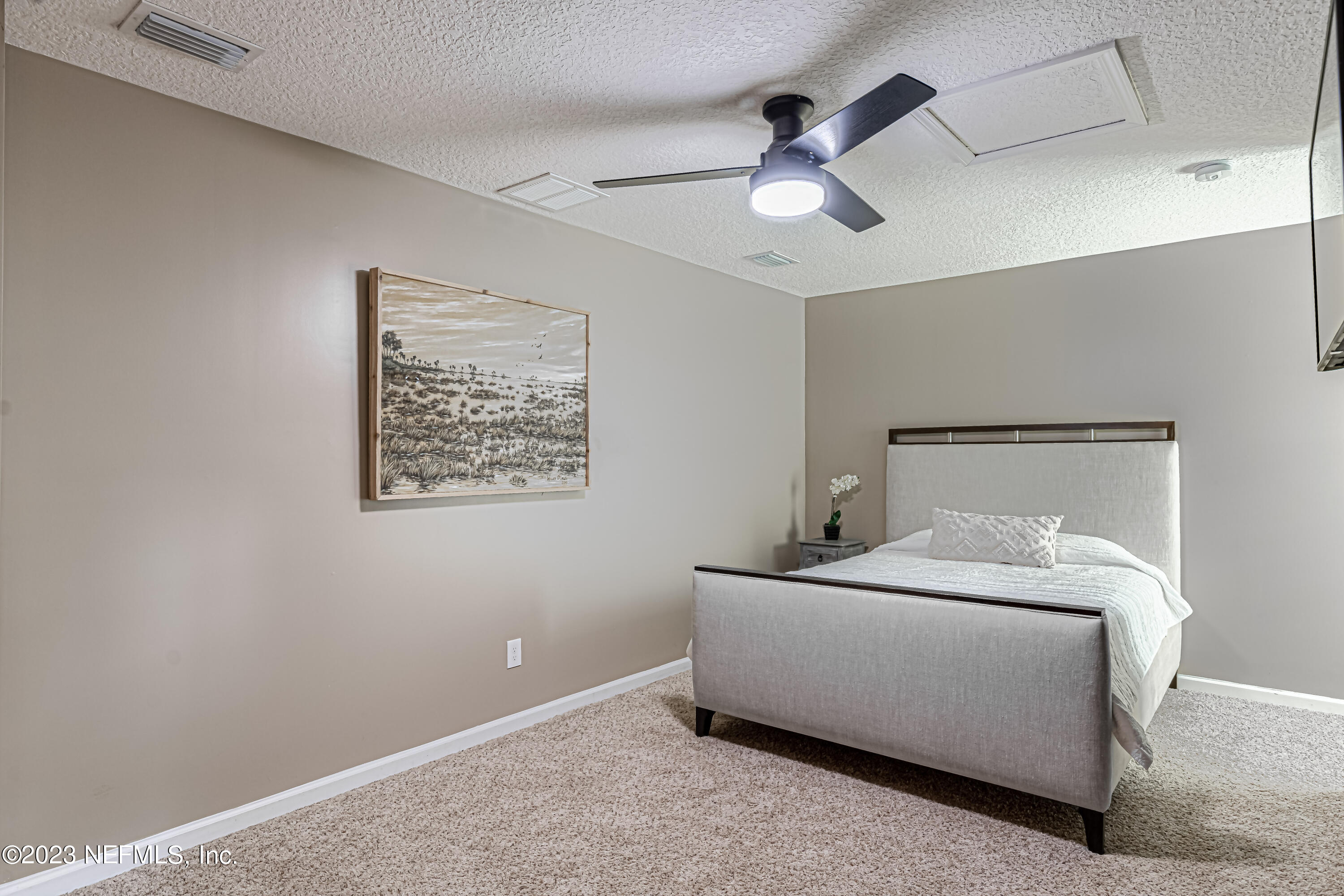 1199 Hatcher Road Middleburg, FL 32068 - Photo 40 of 55 a bedroom with a bed and a ceiling fan