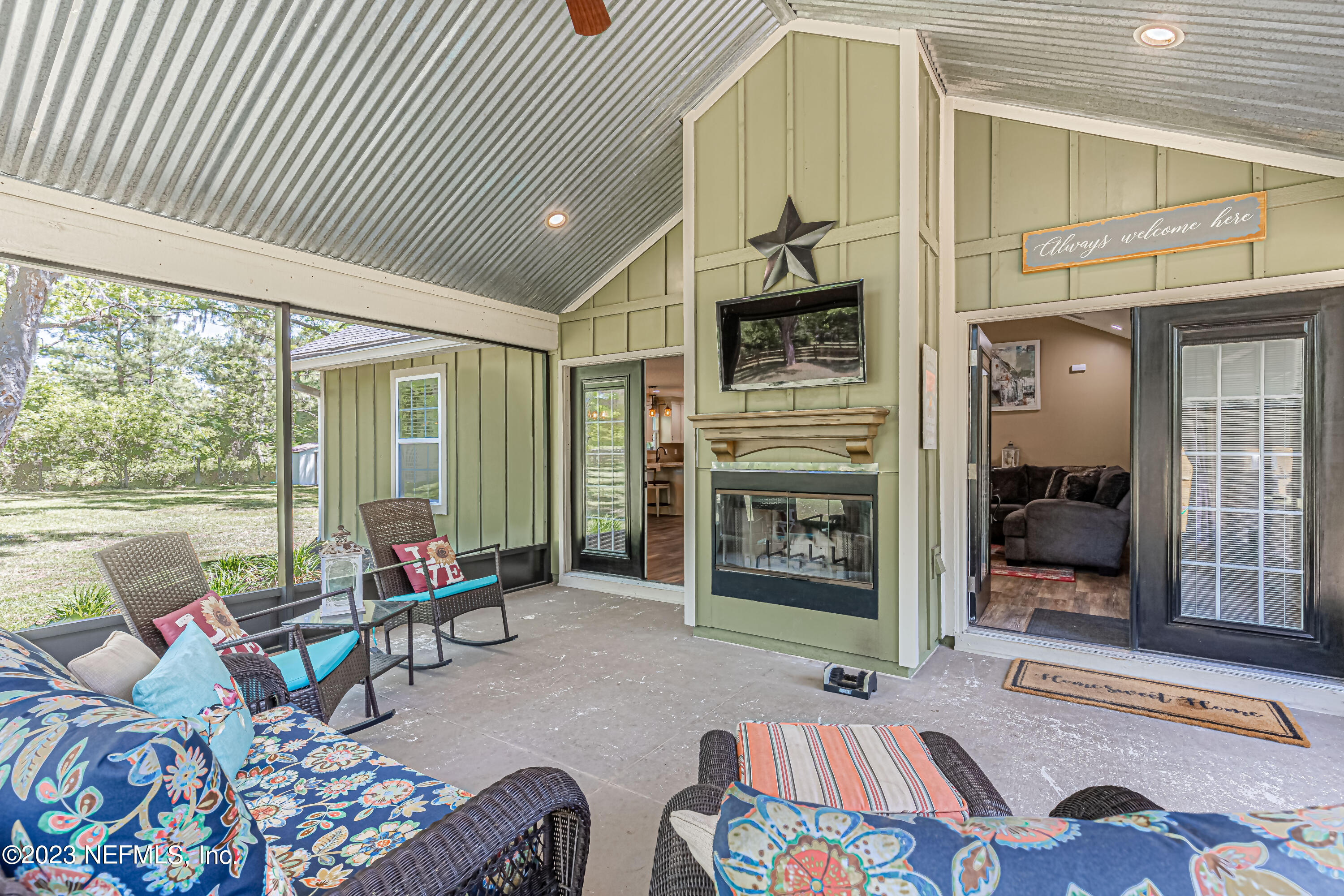 1199 Hatcher Road Middleburg, FL 32068 - Photo 42 of 55 a bedroom with furniture and a fireplace