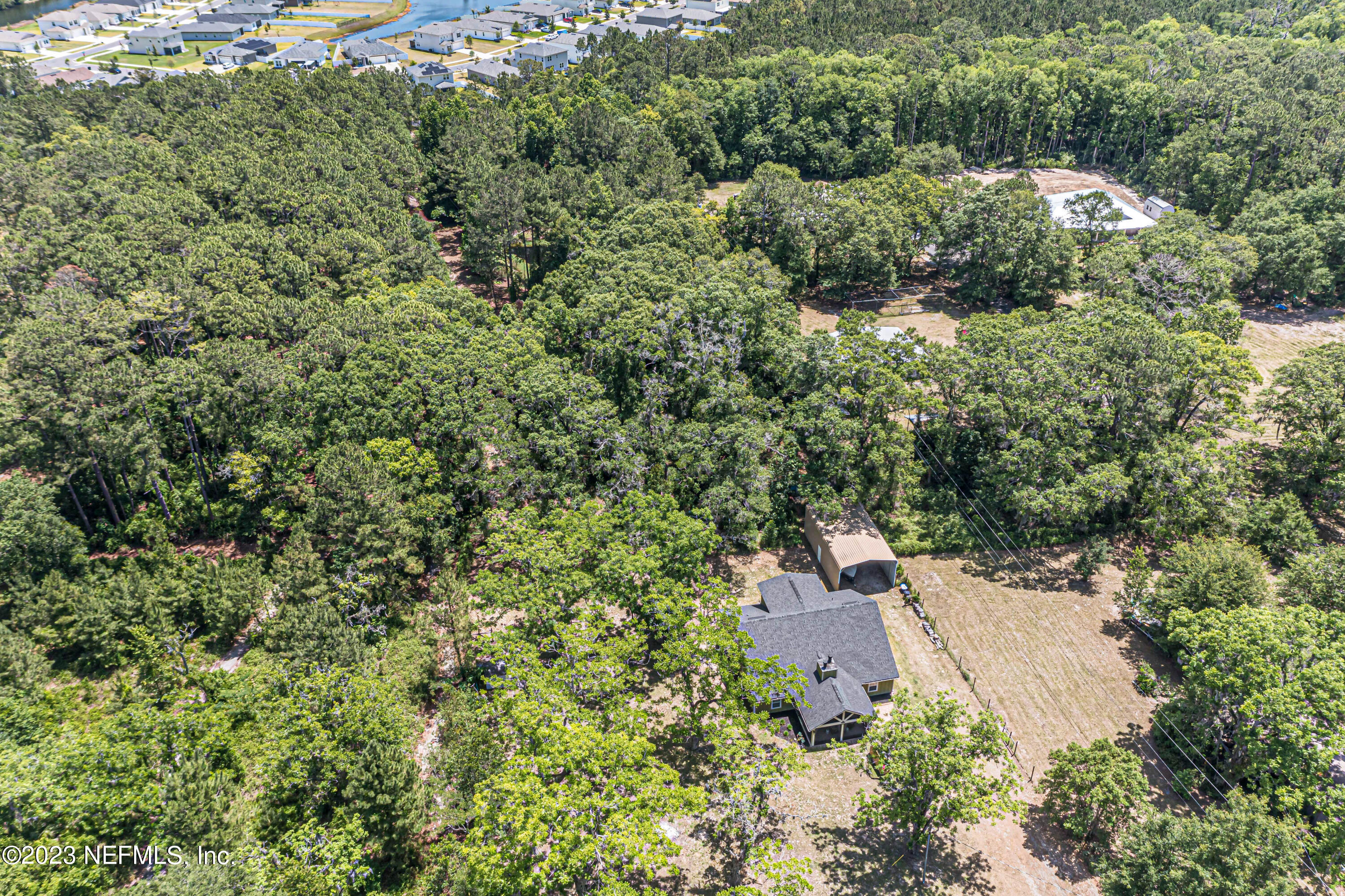 1199 Hatcher Road Middleburg, FL 32068 - Photo 48 of 55 an aerial view of a house with a yard