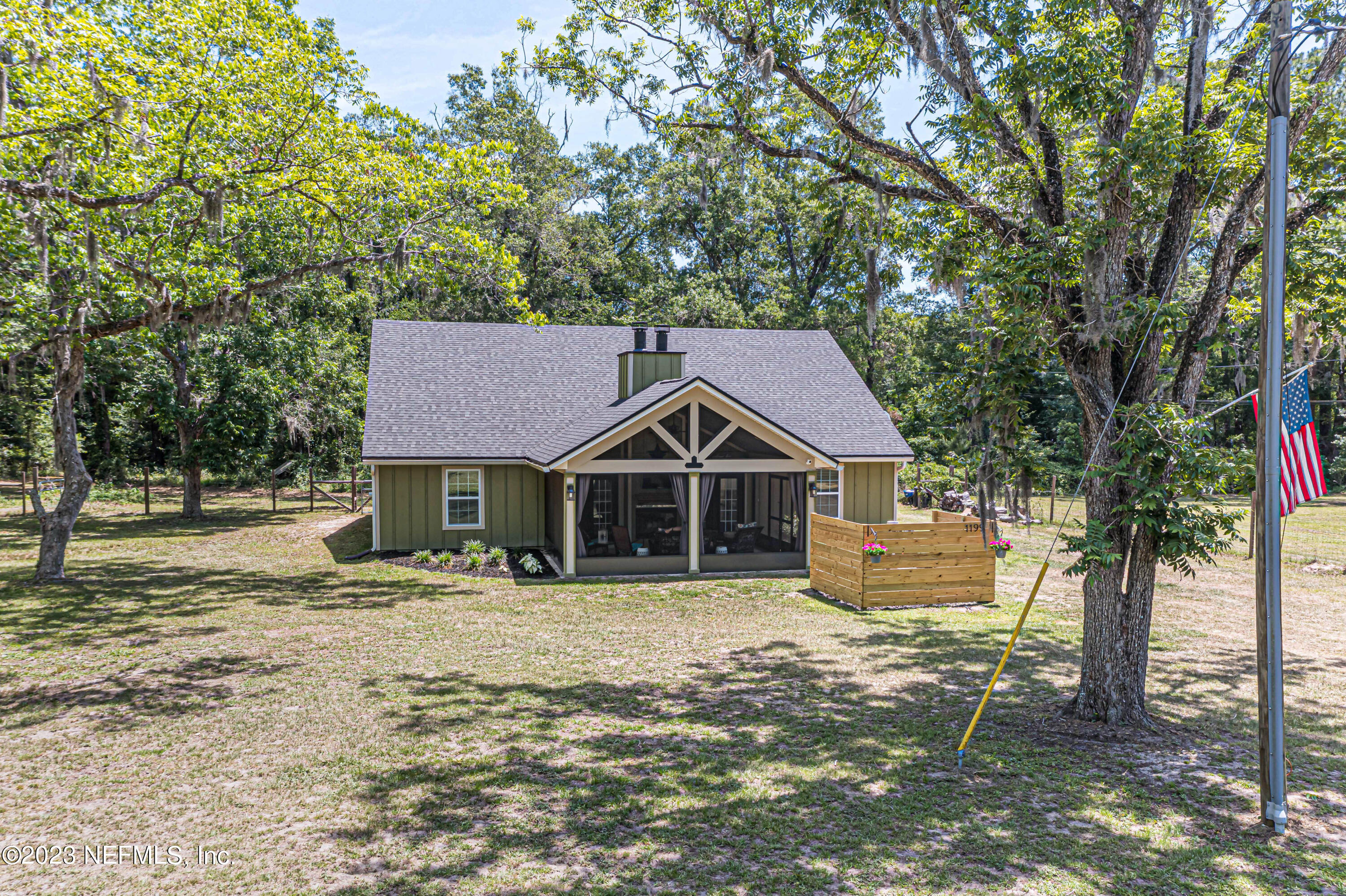 1199 Hatcher Road Middleburg, FL 32068 - Photo 49 of 55 a front view of a house with a yard covered in snow