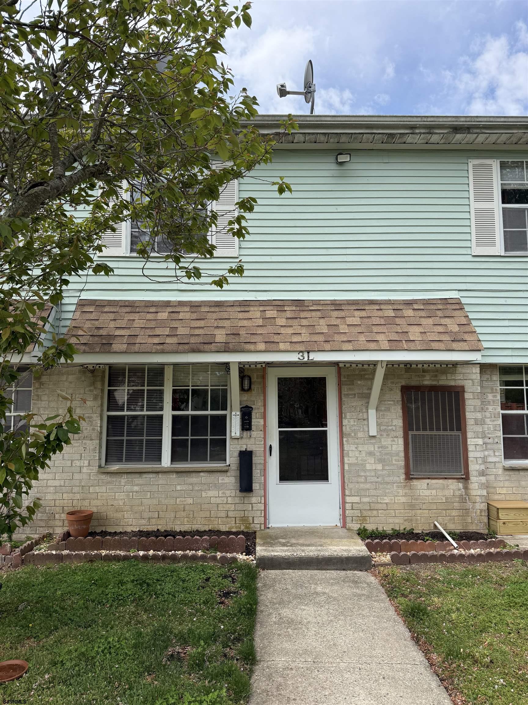 720 South New Road, Unit 3L Absecon, NJ 08201 - Photo 1 of 25 a front view of a house with a garden