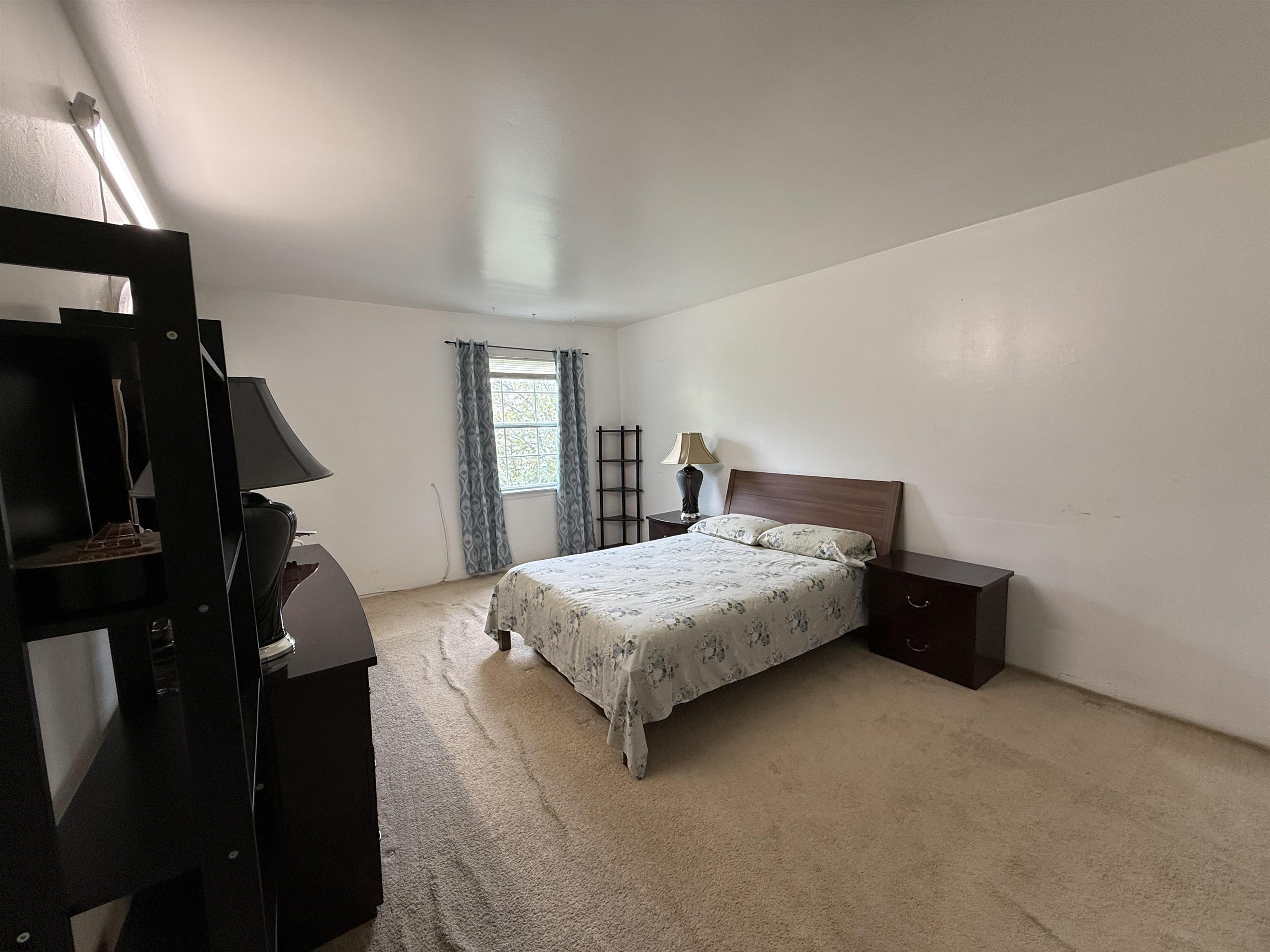 720 South New Road, Unit 3L Absecon, NJ 08201 - Photo 15 of 25 a bedroom with a bed and wooden floor