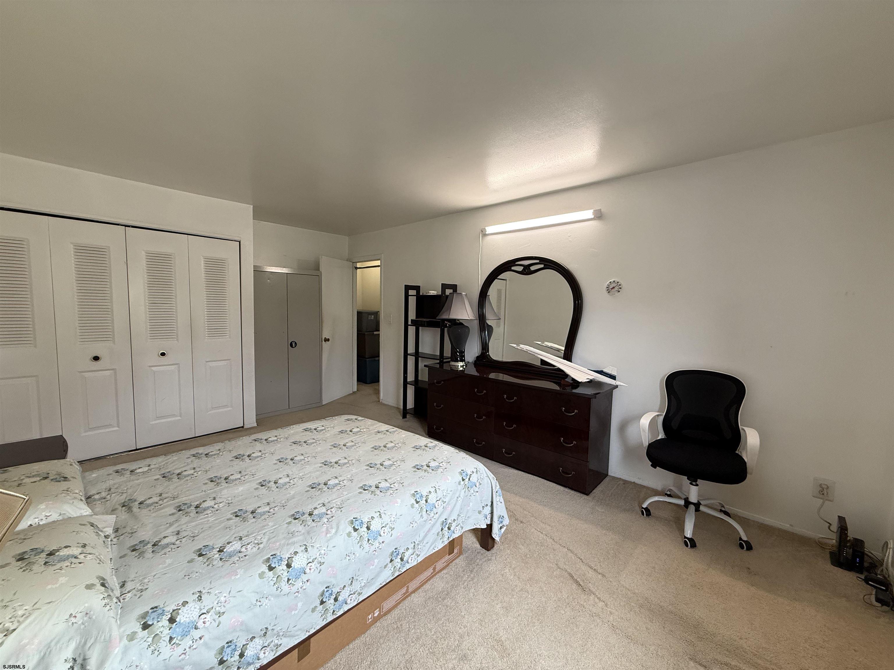 720 South New Road, Unit 3L Absecon, NJ 08201 - Photo 17 of 25 a bedroom with a bed and a dresser