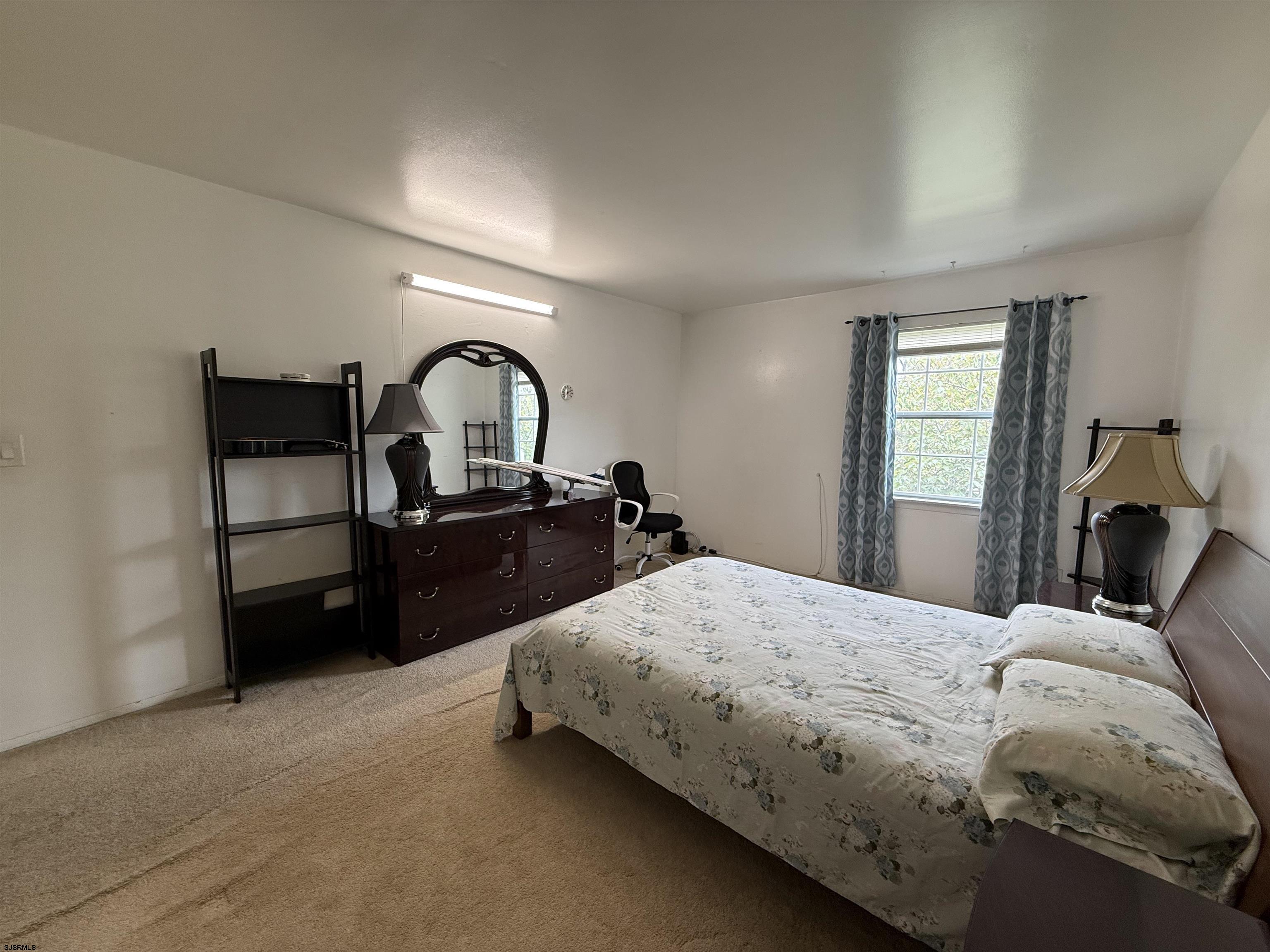 720 South New Road, Unit 3L Absecon, NJ 08201 - Photo 18 of 25 a bedroom with a bed and a closet